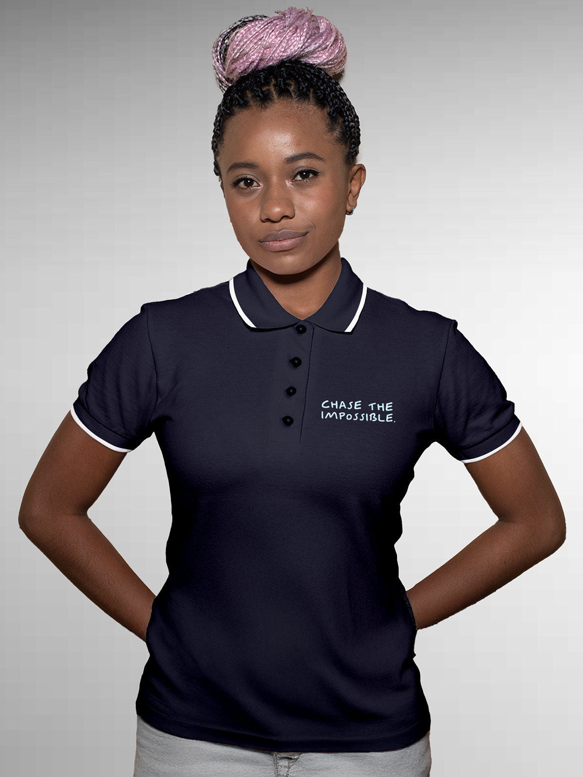 Model wearing Women's Navy Blue Polo T-shirt with 'Chase The Impossible' design, offering effortless style and premium comfort
