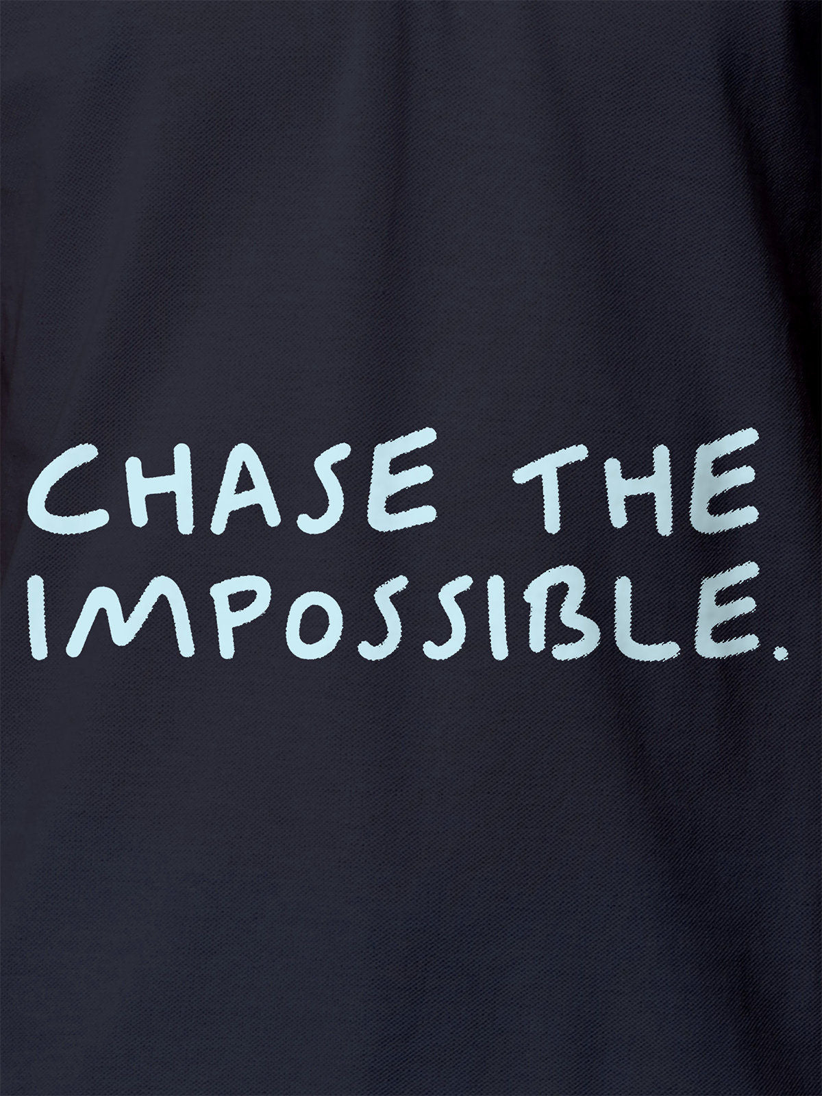 Close up of 'Chase The Impossible' design on Women's Navy Blue Polo T-shirt, highlighting intricate details and vibrant print.
