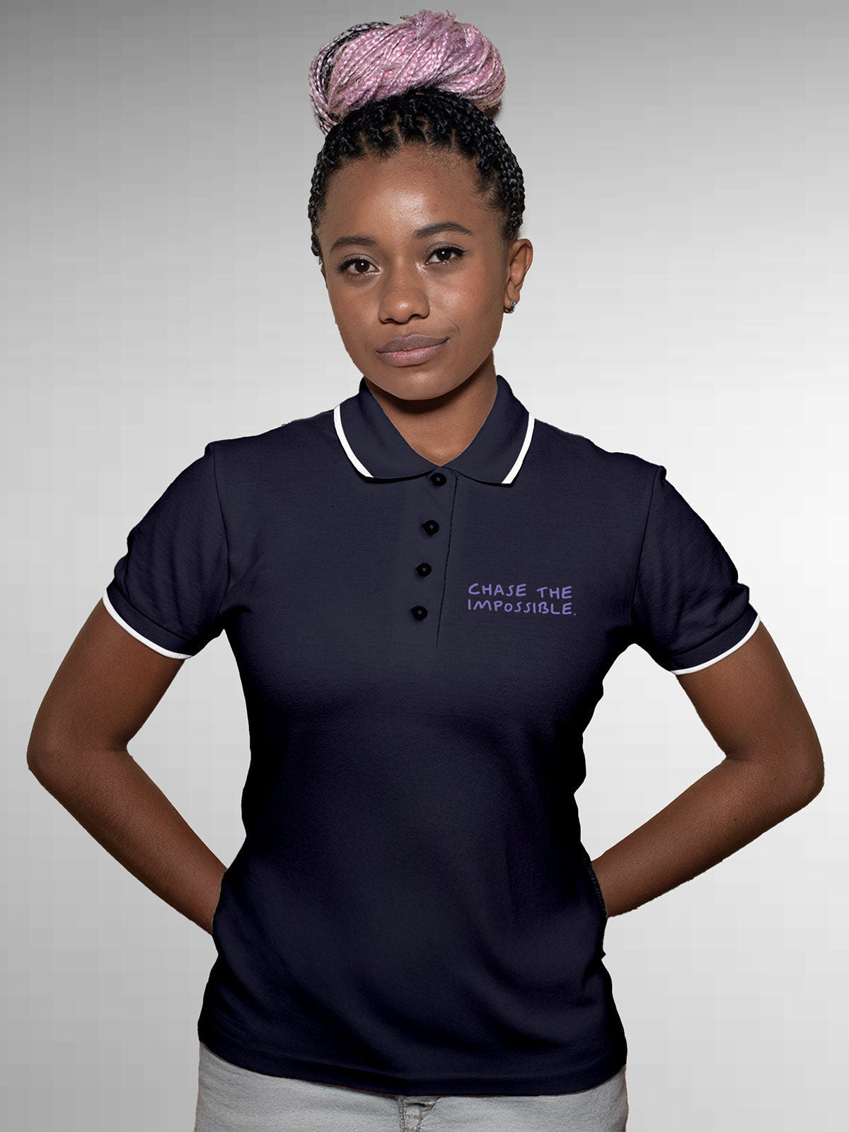 Model wearing Women's Navy Blue Polo T-shirt with 'Chase The Impossible' design, offering effortless style and premium comfort