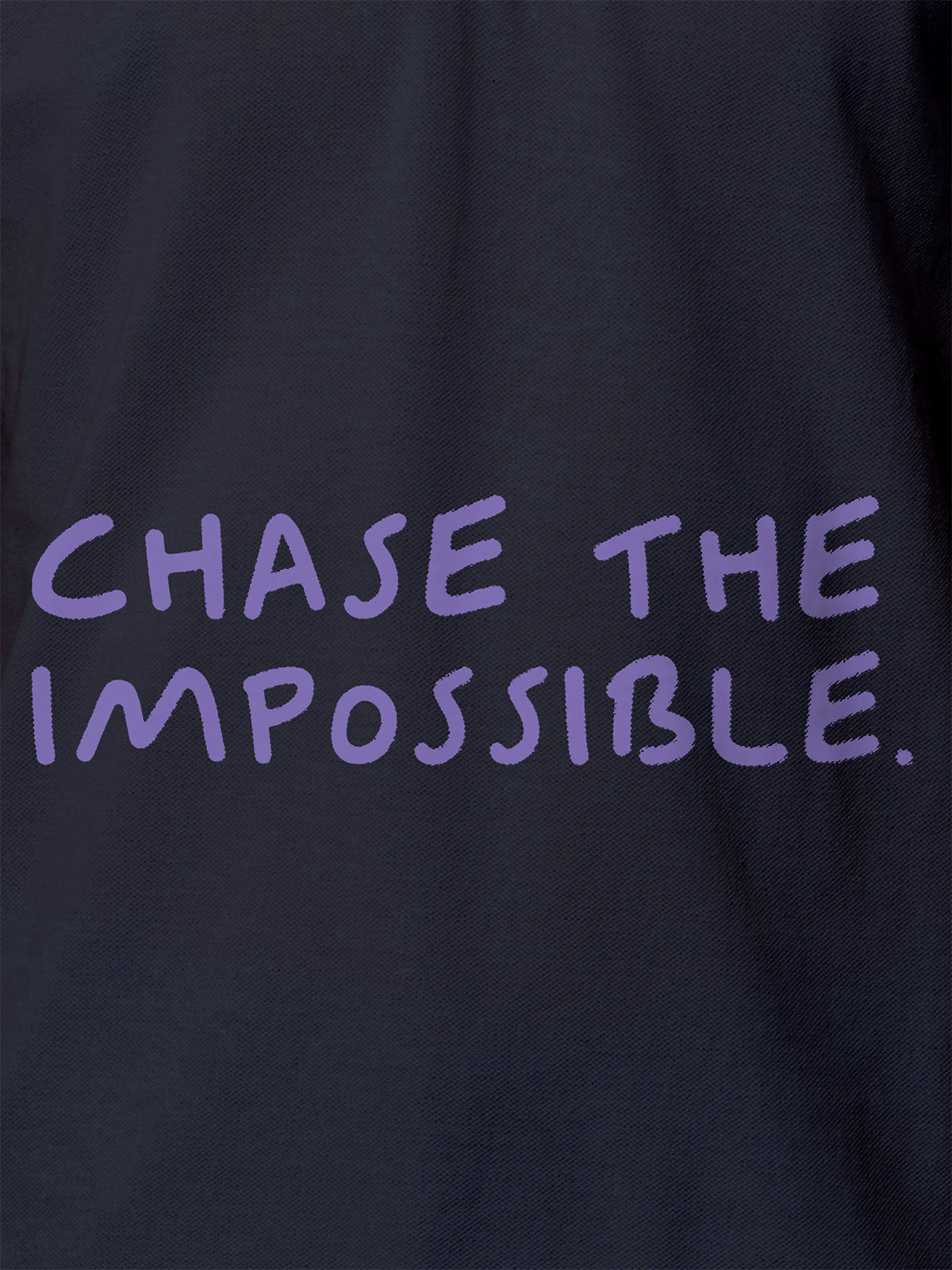 Close up of 'Chase The Impossible' design on Women's Navy Blue Polo T-shirt, highlighting intricate details and vibrant print.