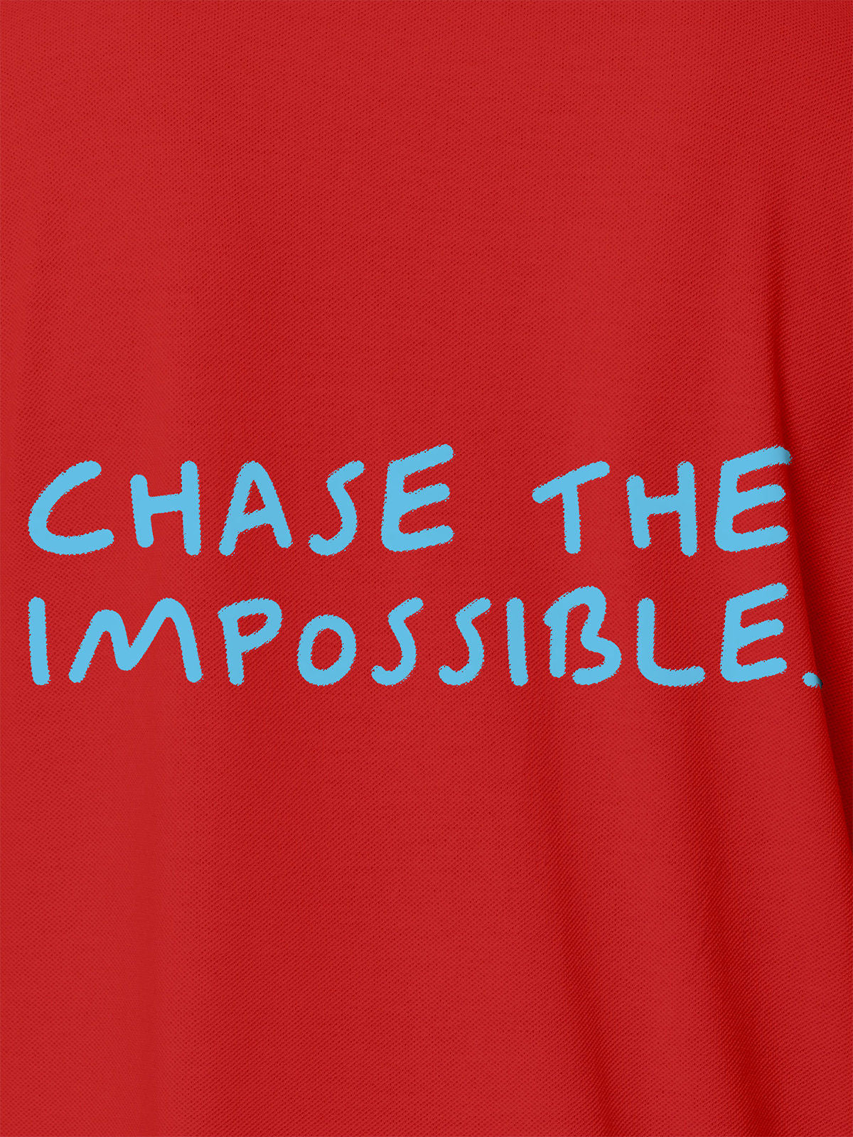 Close up of 'Chase The Impossible' design on Men's Red Polo T-shirt, highlighting intricate details and vibrant print.