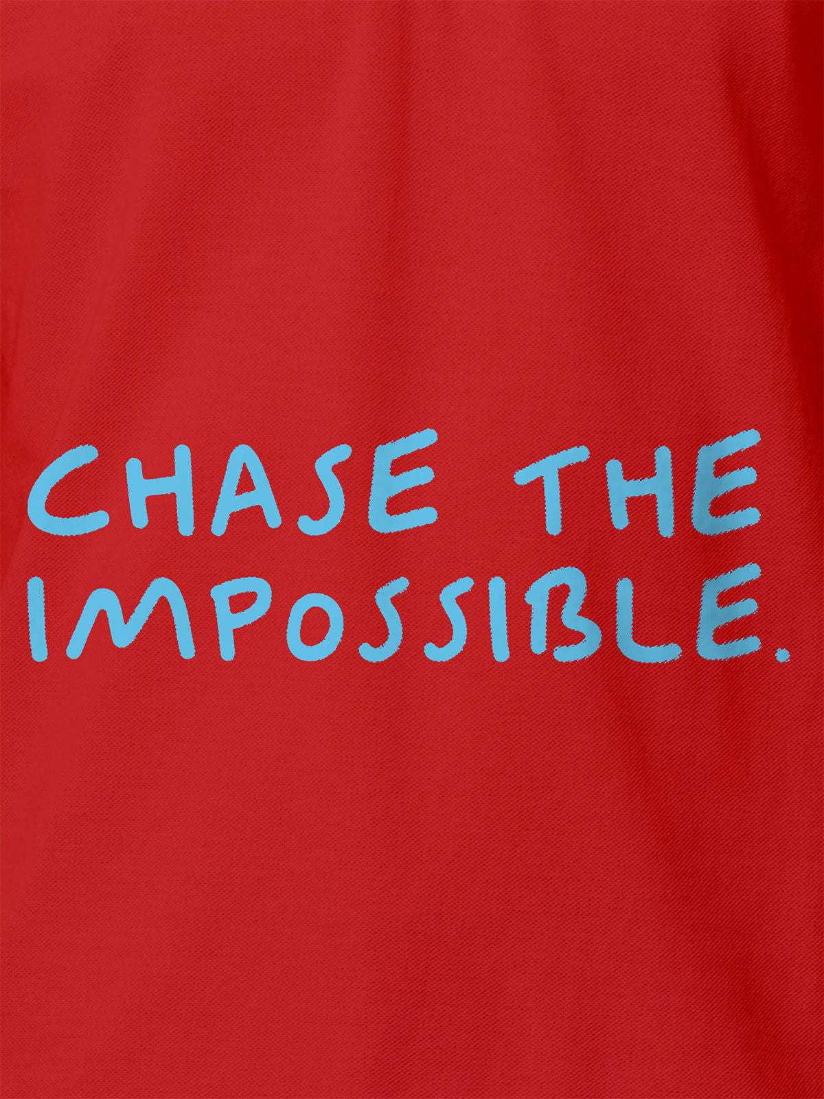 Close up of 'Chase The Impossible' design on Women's Red Polo T-shirt, highlighting intricate details and vibrant print.