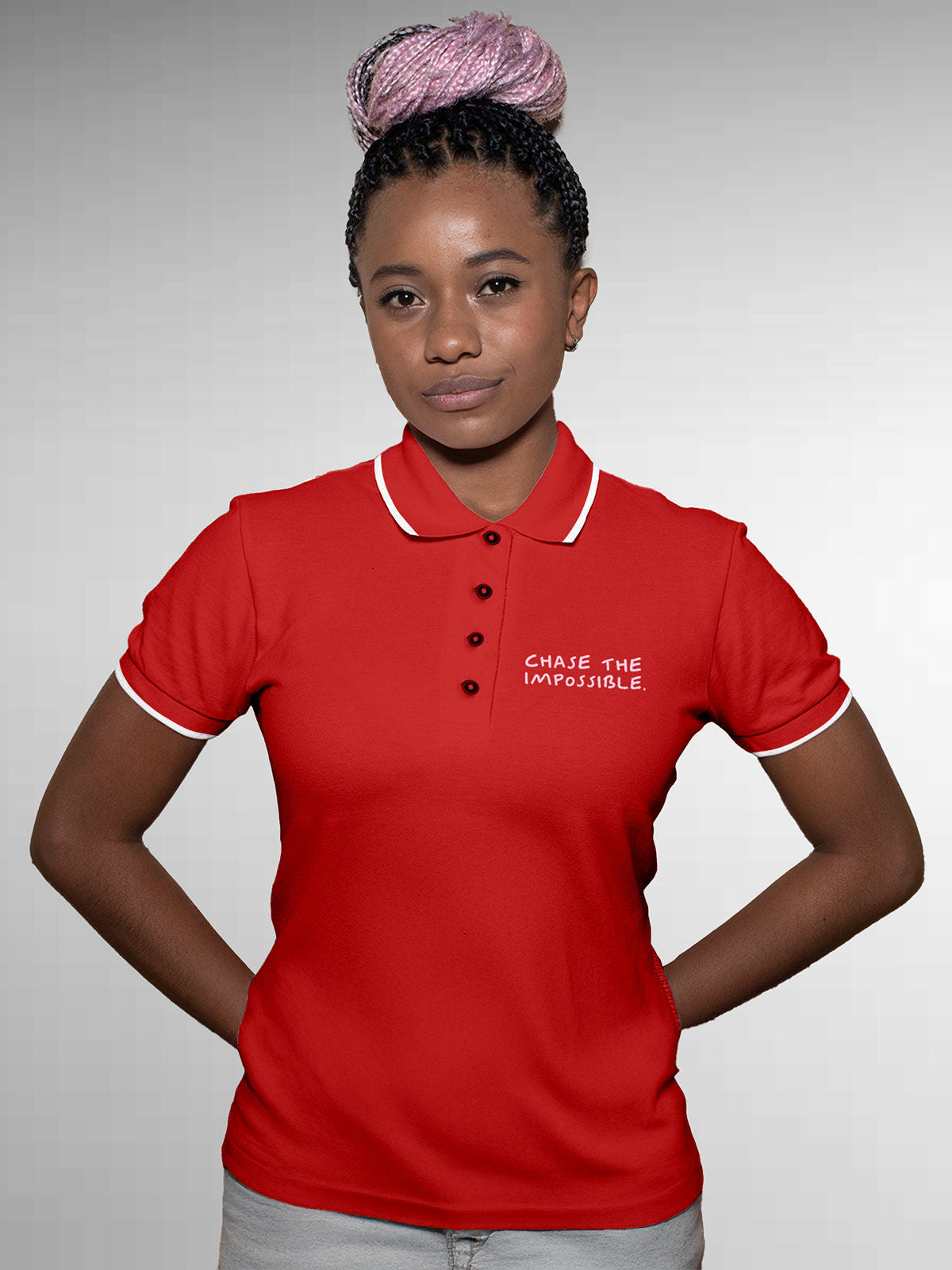 Model wearing Women's Red Polo T-shirt with 'Chase The Impossible' design, offering effortless style and premium comfort