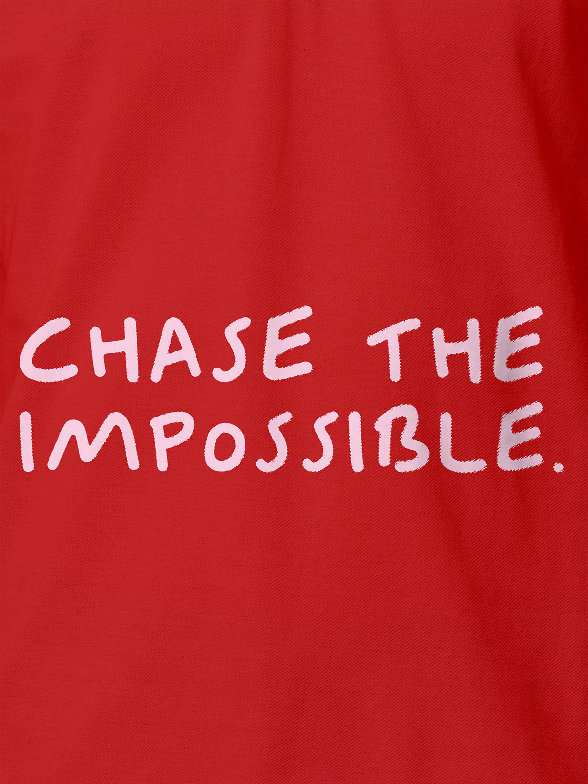 Close up of 'Chase The Impossible' design on Women's Red Polo T-shirt, highlighting intricate details and vibrant print.