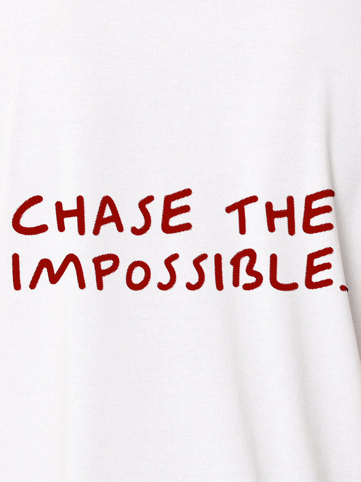 Close up of 'Chase The Impossible' design on Men's White Polo T-shirt, highlighting intricate details and vibrant print.