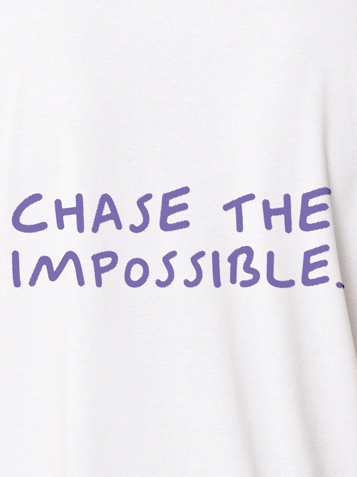 Close up of 'Chase The Impossible' design on Men's White Polo T-shirt, highlighting intricate details and vibrant print.