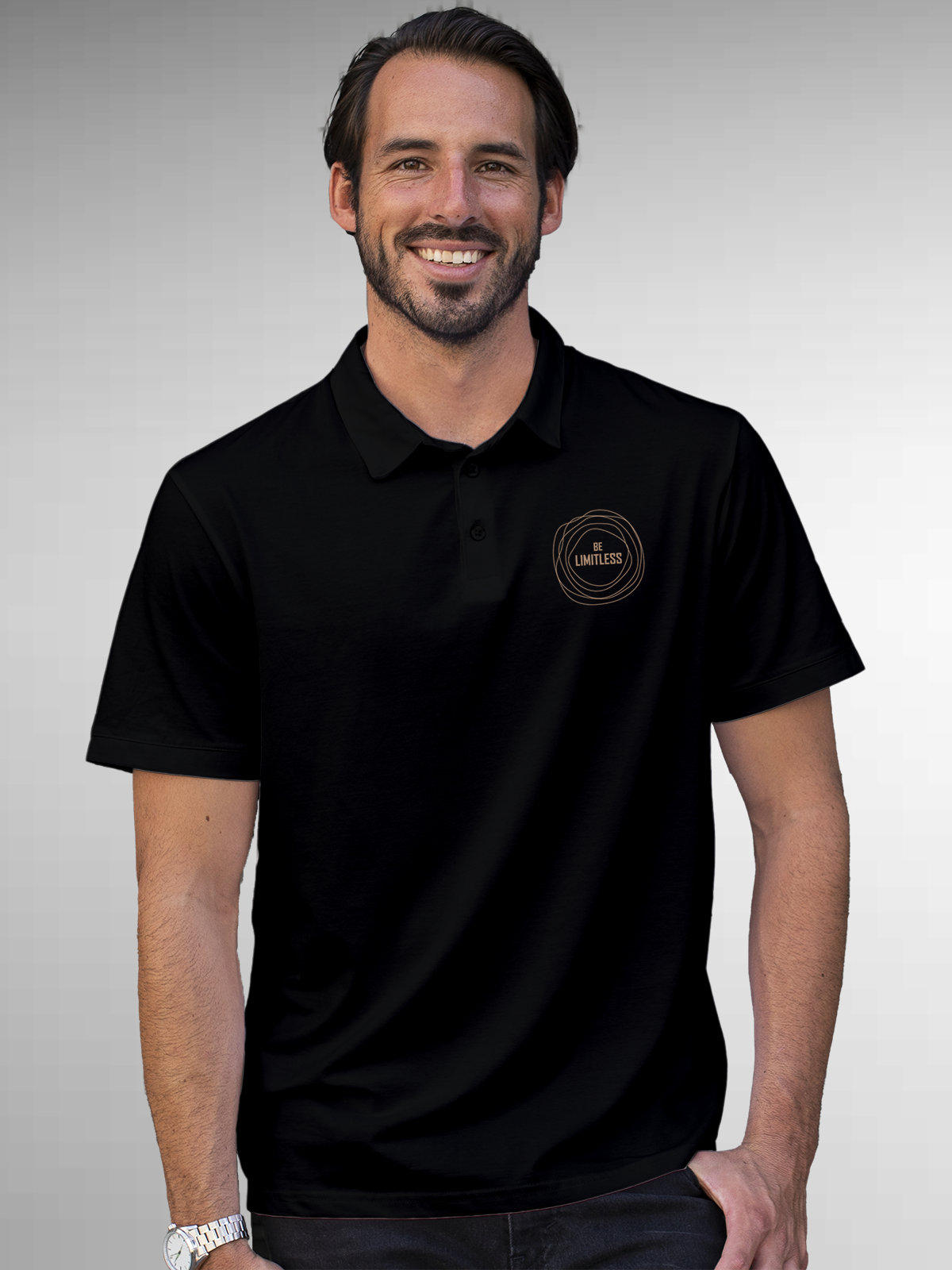 Model wearing Men's Black Polo T-shirt with 'Be Limitless' design, offering effortless style and premium comfort