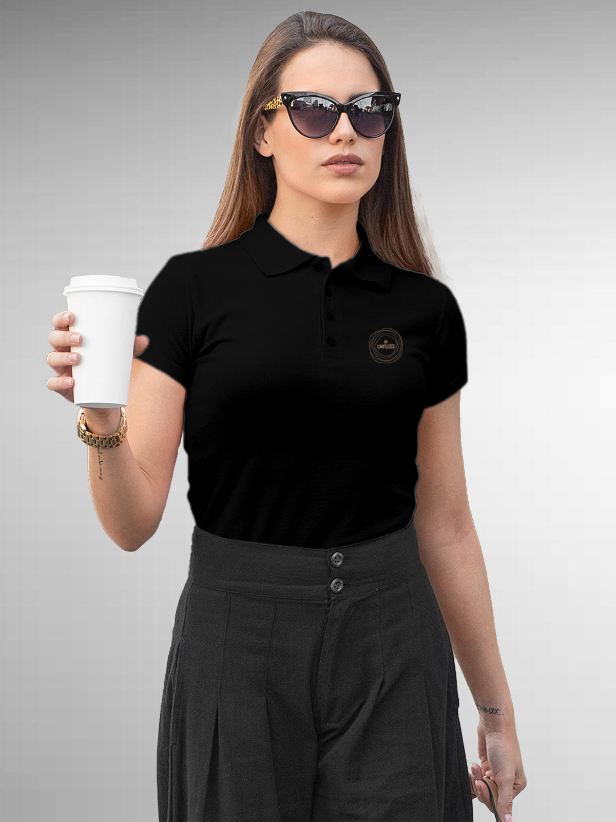 Model wearing Women's Black Polo T-shirt with 'Be Limitless' design, offering effortless style and premium comfort