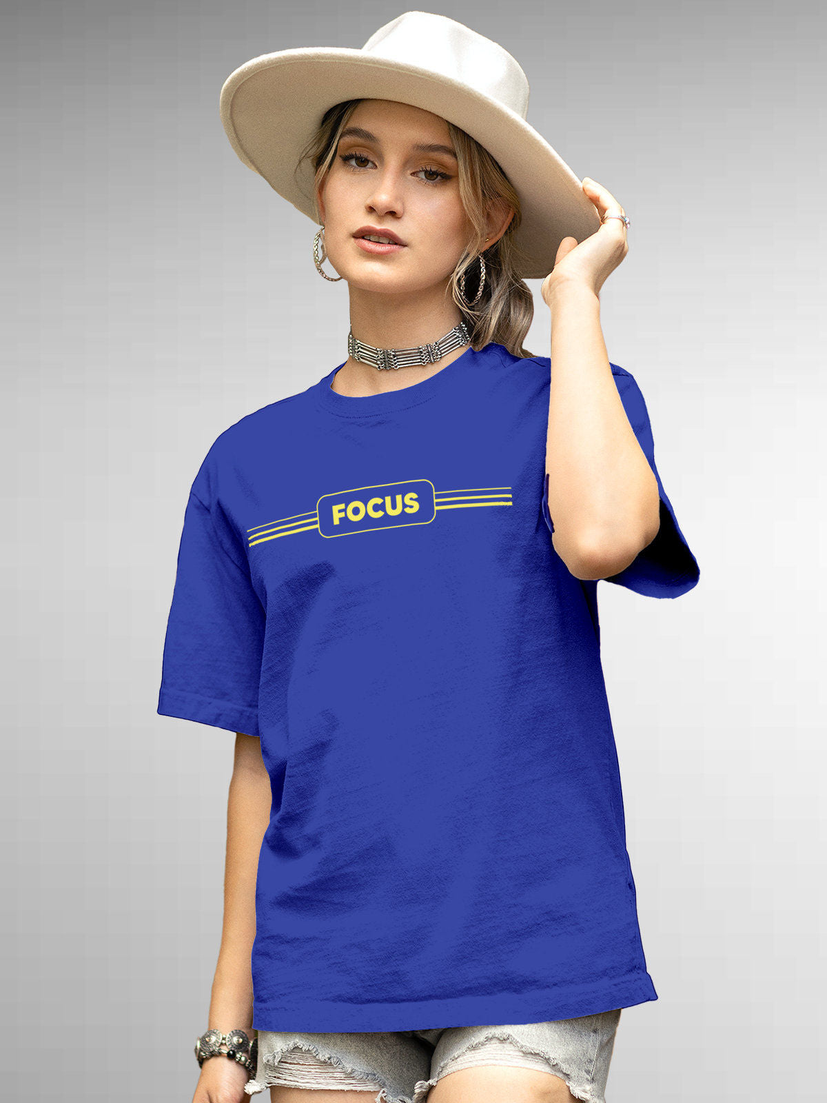Model wearing Women's Blue Round Neck T-shirt with 'Focus' design, offering effortless style and premium comfort