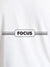 Close up of 'Focus' design on Women's White Round Neck T-shirt, highlighting intricate details and vibrant print.