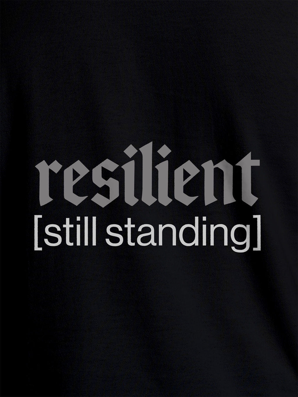 Close up of 'Resilient' design on Women's Black Round Neck T-shirt, highlighting intricate details and vibrant print.