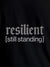 Close up of 'Resilient' design on Women's Black Round Neck T-shirt, highlighting intricate details and vibrant print.