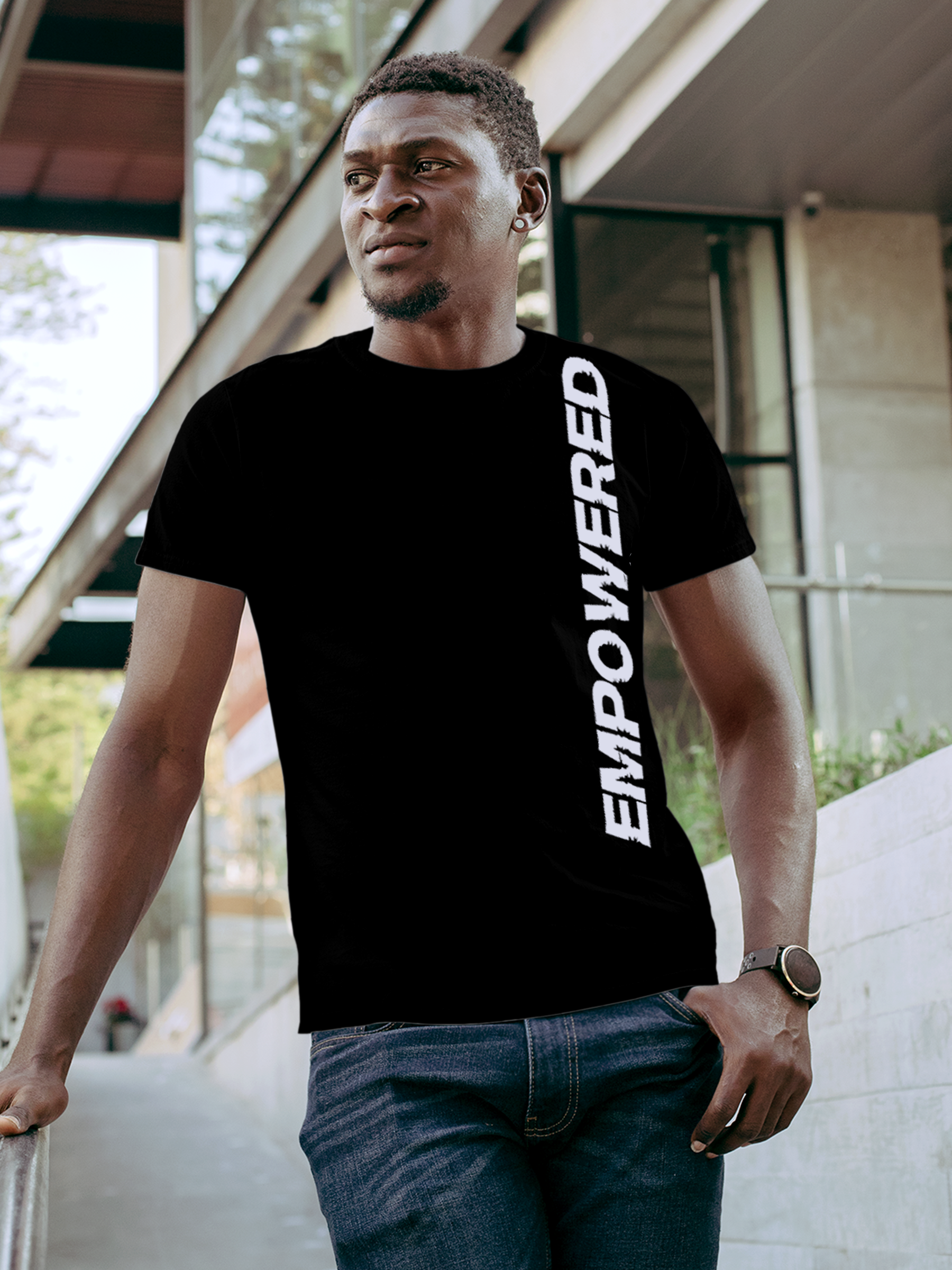 Model wearing Men's Black Round Neck T-shirt with 'Empowered' design, offering effortless style and premium comfort