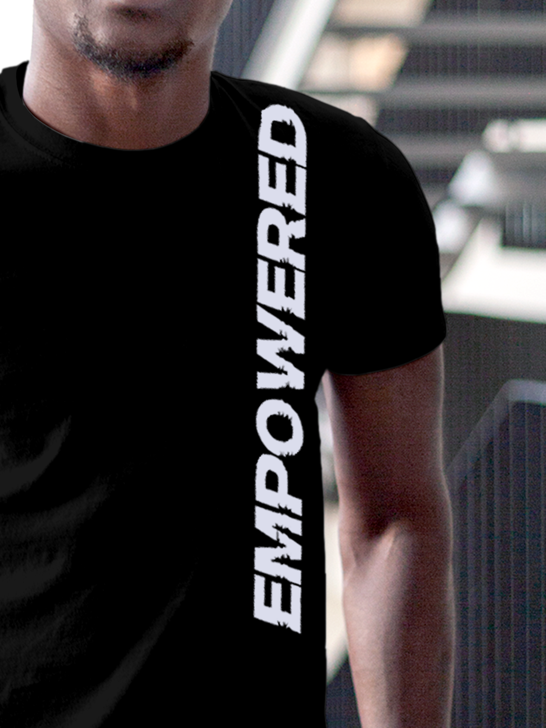 Close up of 'Empowered' design on Men's Black Round Neck T-shirt, highlighting intricate details and vibrant print.