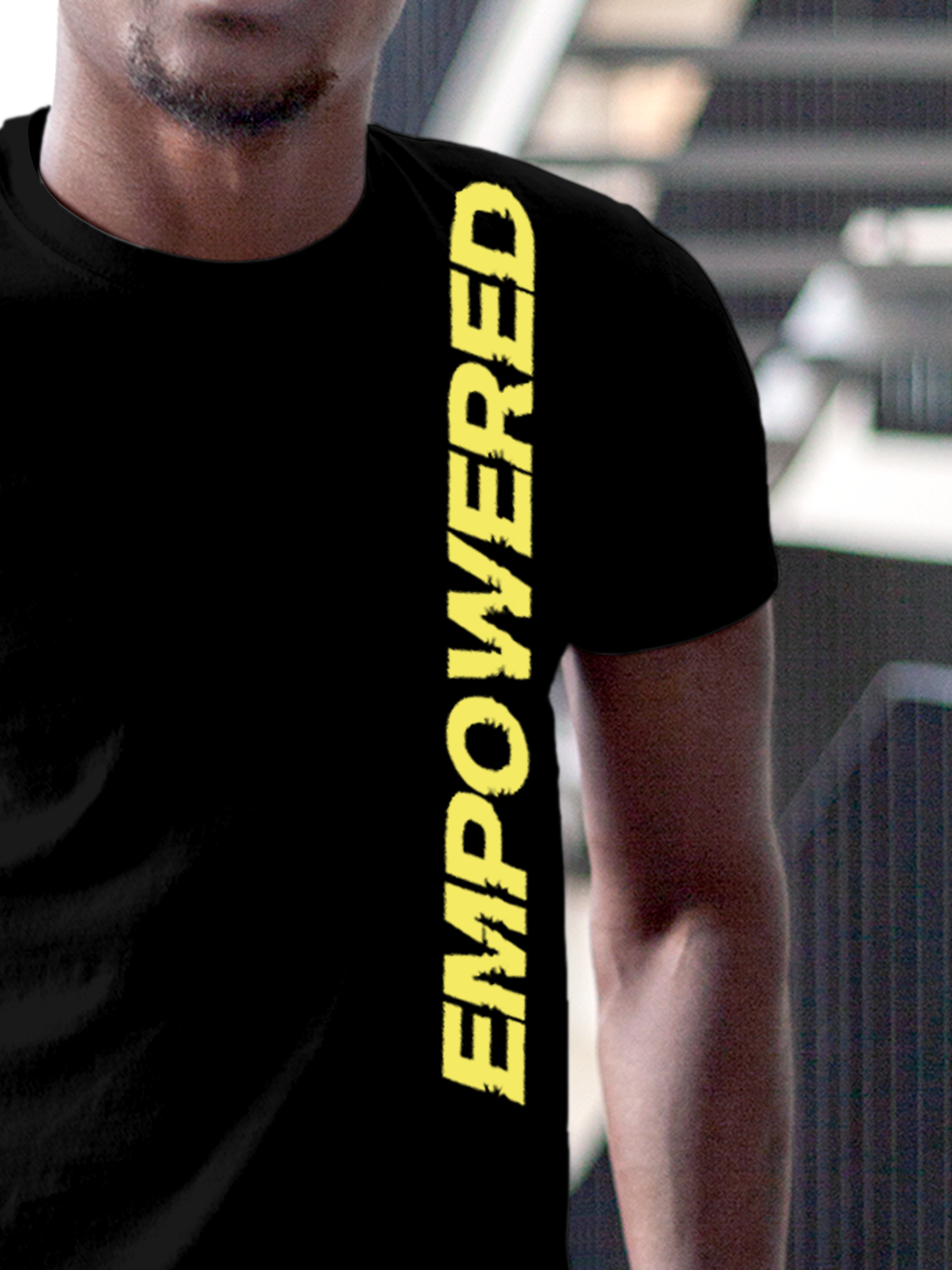 Close up of 'Empowered' design on Men's Black Round Neck T-shirt, highlighting intricate details and vibrant print.