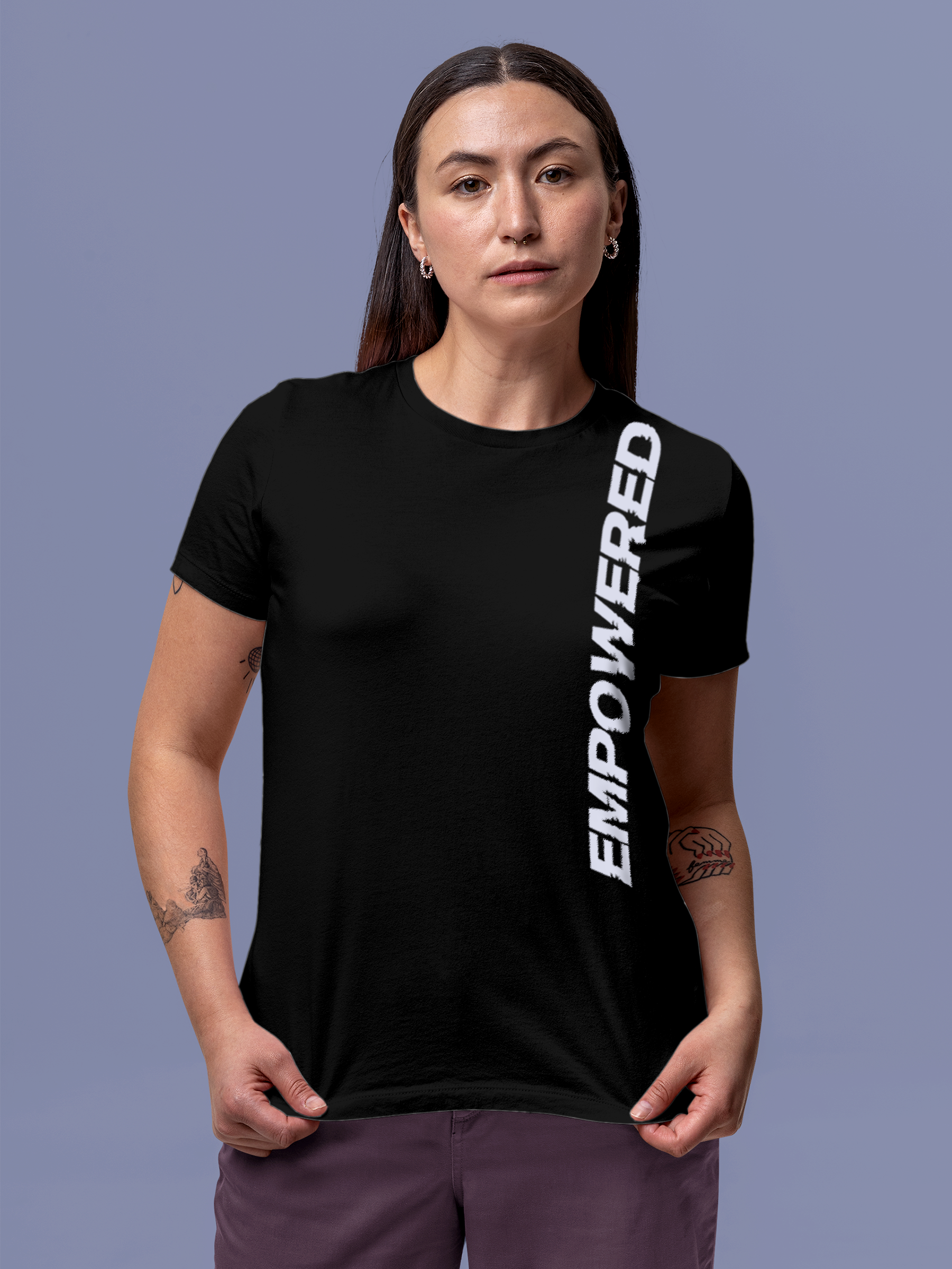 Model wearing Women's Black Round Neck T-shirt with 'Empowered' design, offering effortless style and premium comfort