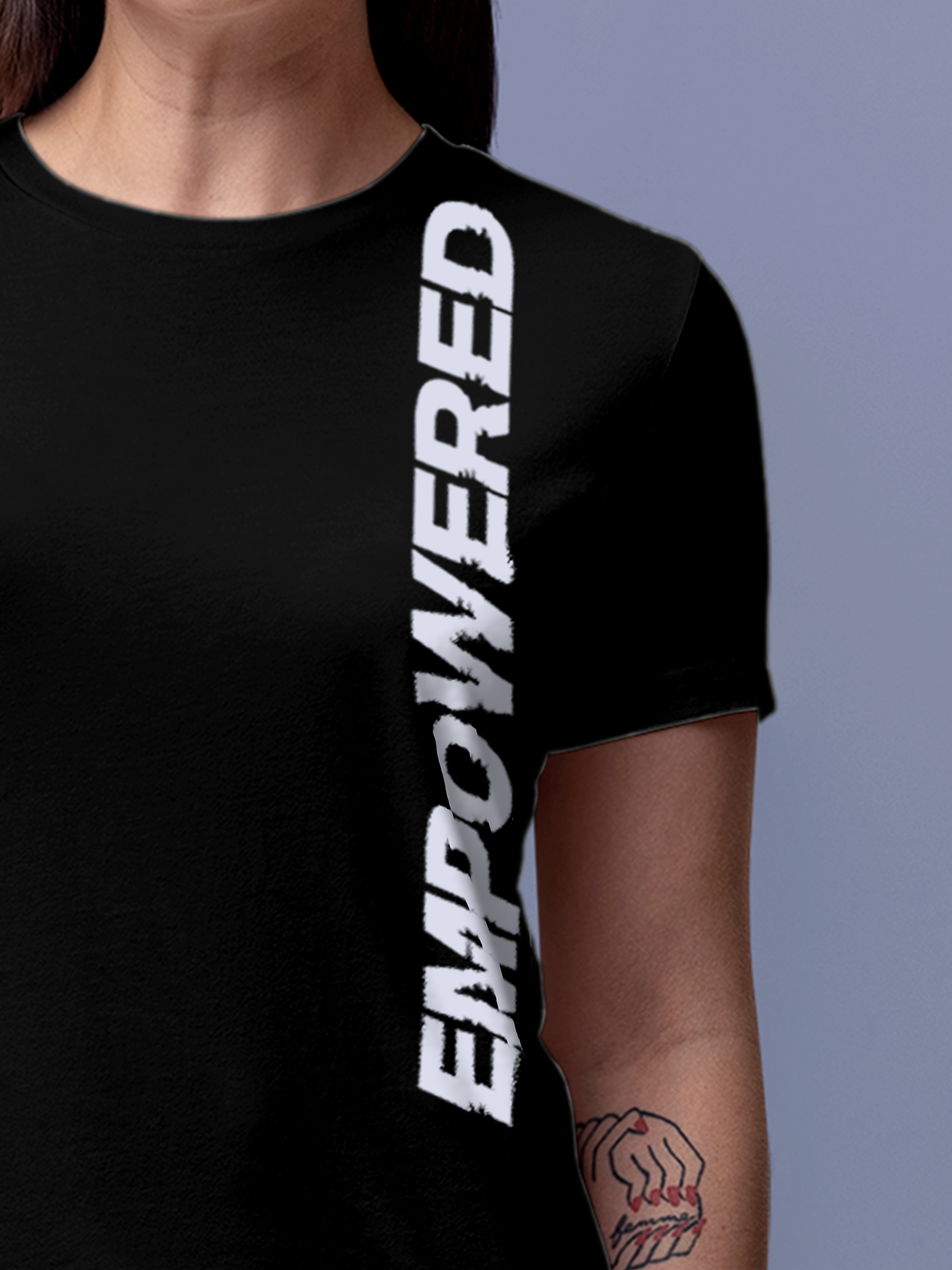 Close up of 'Empowered' design on Women's Black Round Neck T-shirt, highlighting intricate details and vibrant print.