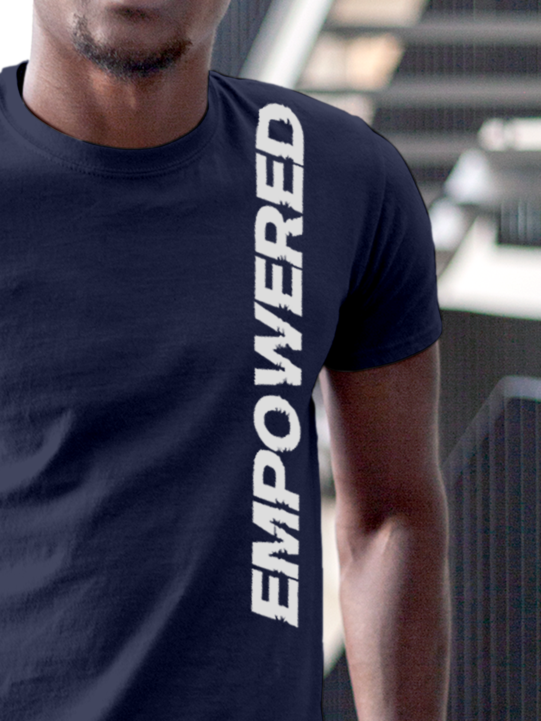 Close up of 'Empowered' design on Men's Navy Blue Round Neck T-shirt, highlighting intricate details and vibrant print.