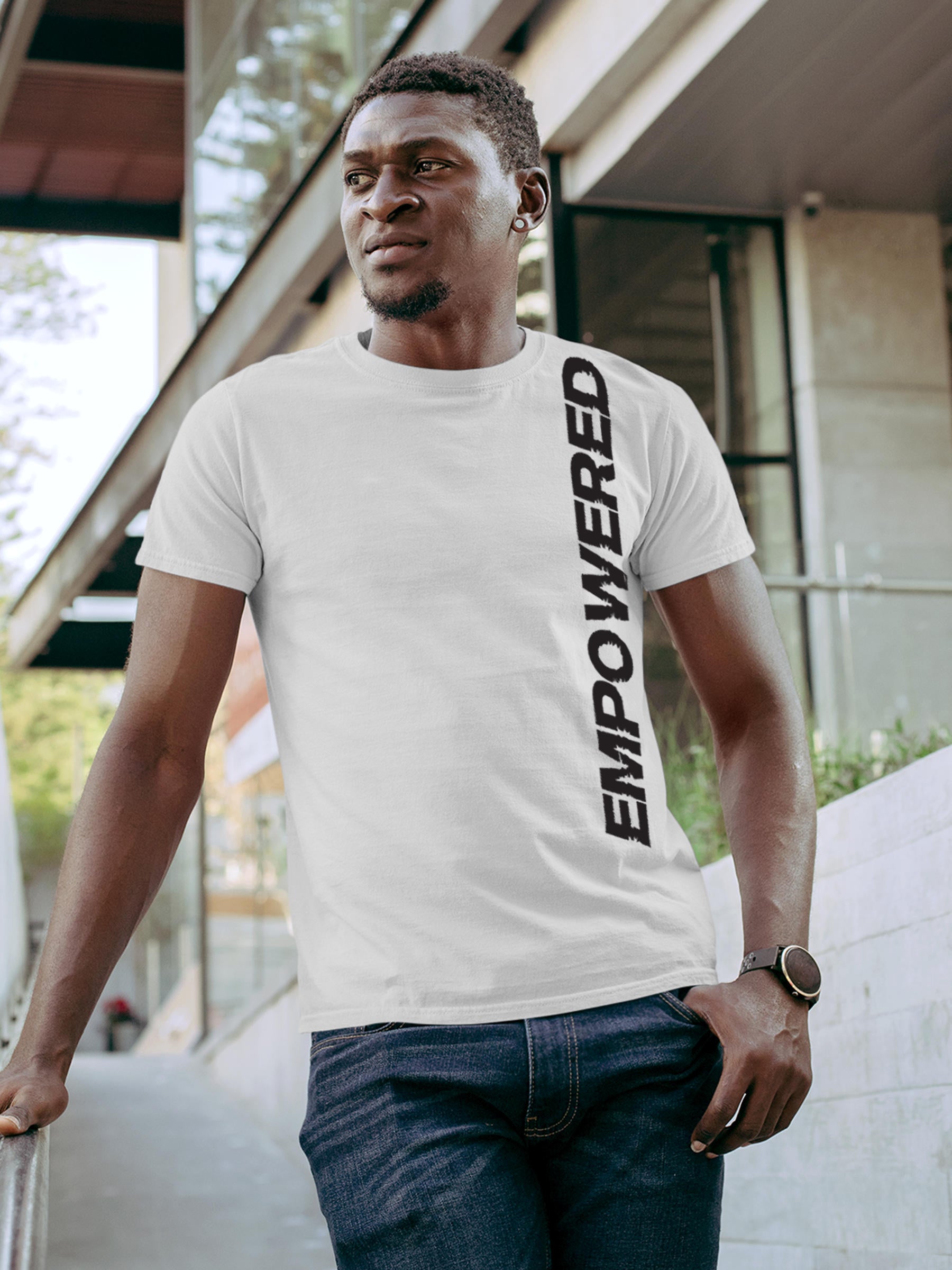 Model wearing Men's White Round Neck T-shirt with 'Empowered' design, offering effortless style and premium comfort