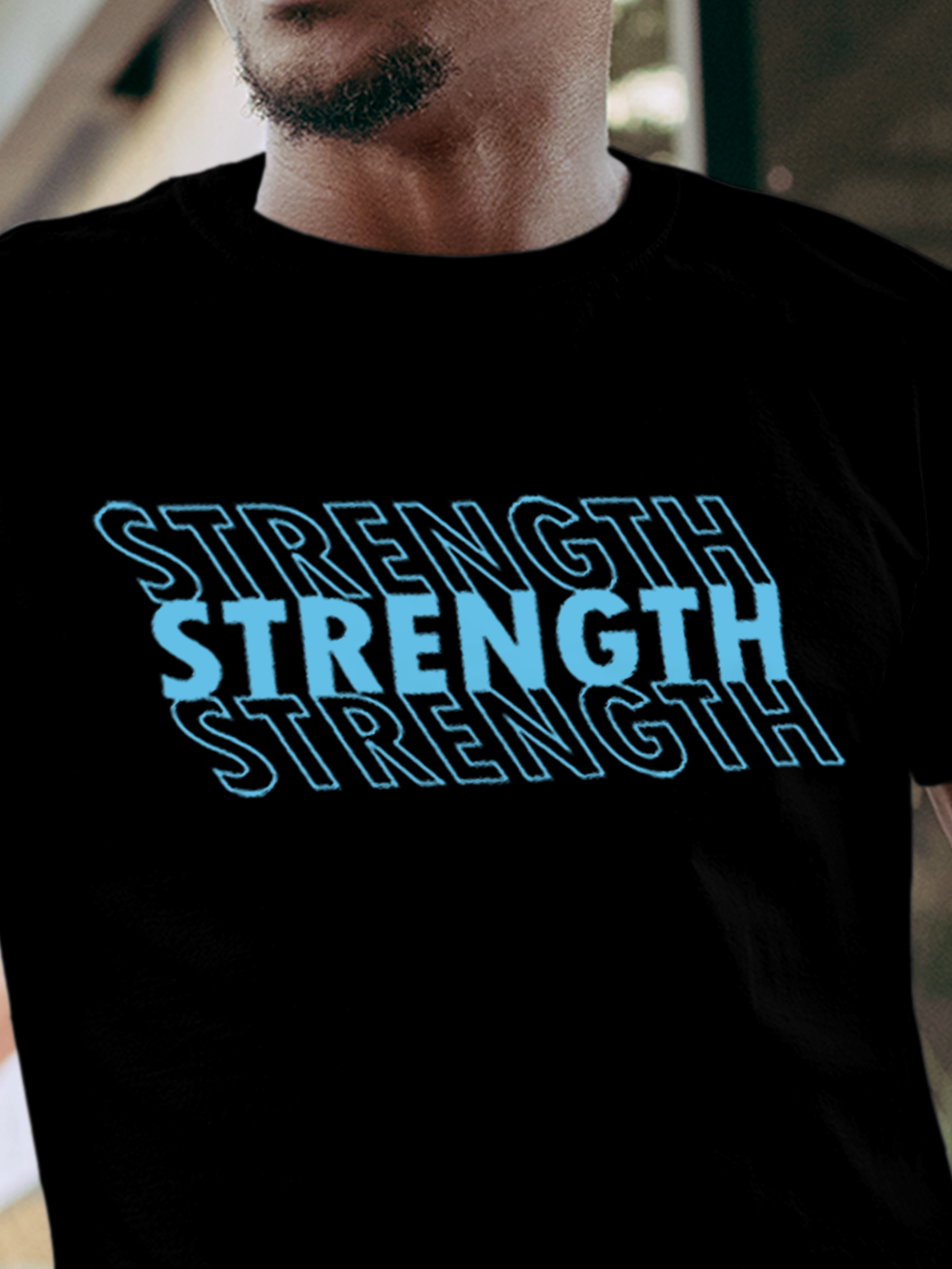 Close up of 'Strength' design on Men's Black Round Neck T-shirt, highlighting intricate details and vibrant print.