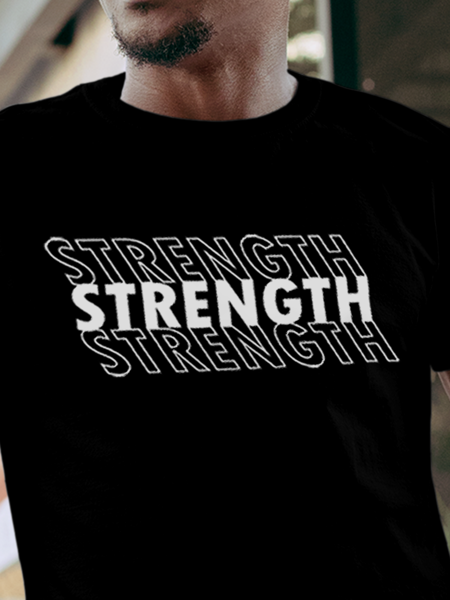 Close up of 'Strength' design on Men's Black Round Neck T-shirt, highlighting intricate details and vibrant print.