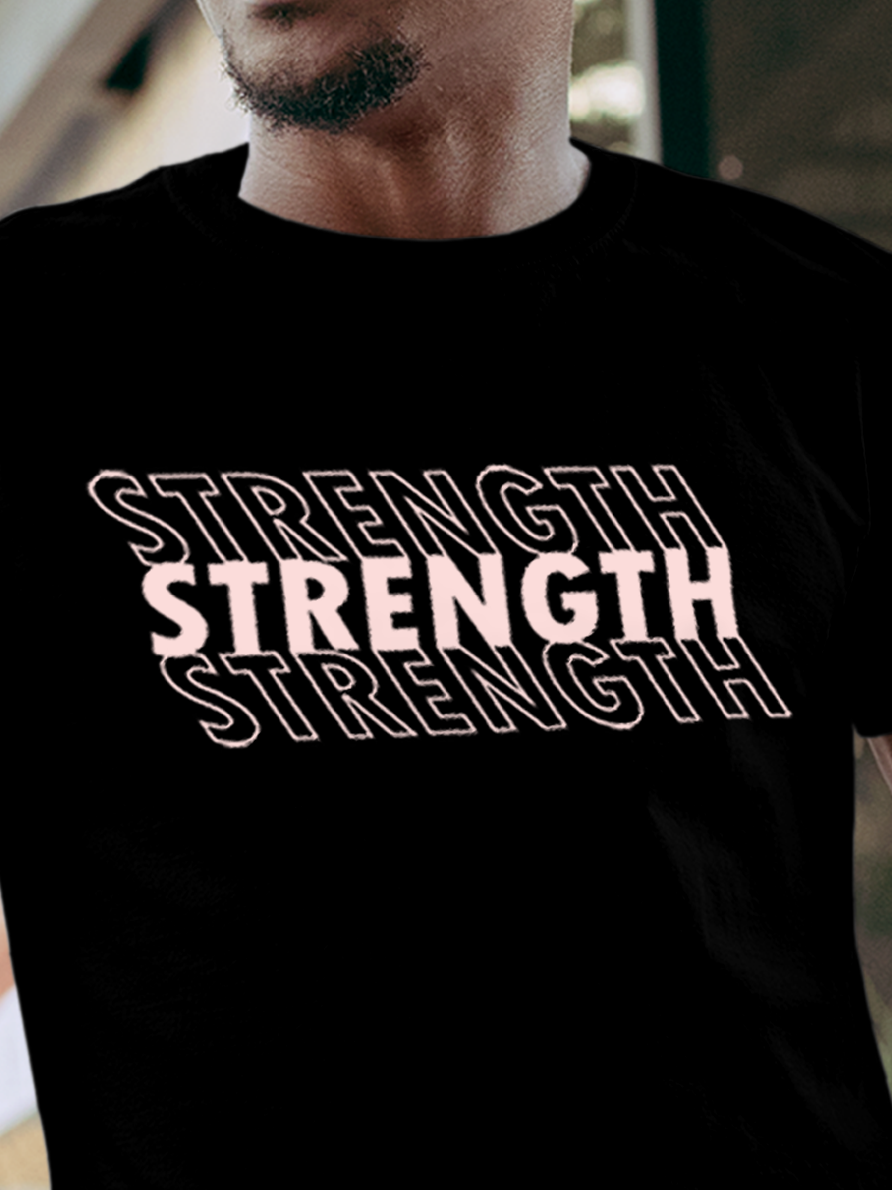 Close up of 'Strength' design on Men's Black Round Neck T-shirt, highlighting intricate details and vibrant print.