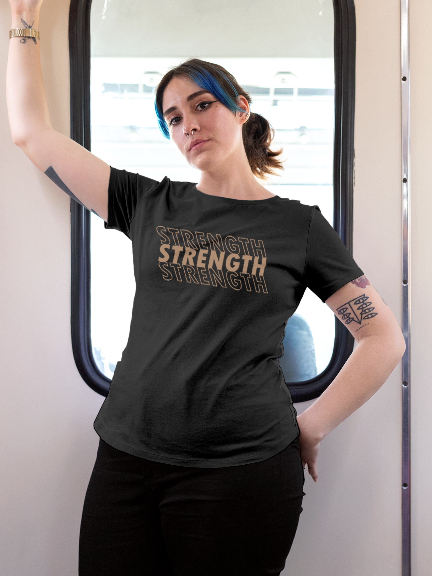 Model wearing Women's Charcoal Grey Round Neck T-shirt with 'Strength' design, offering effortless style and premium comfort