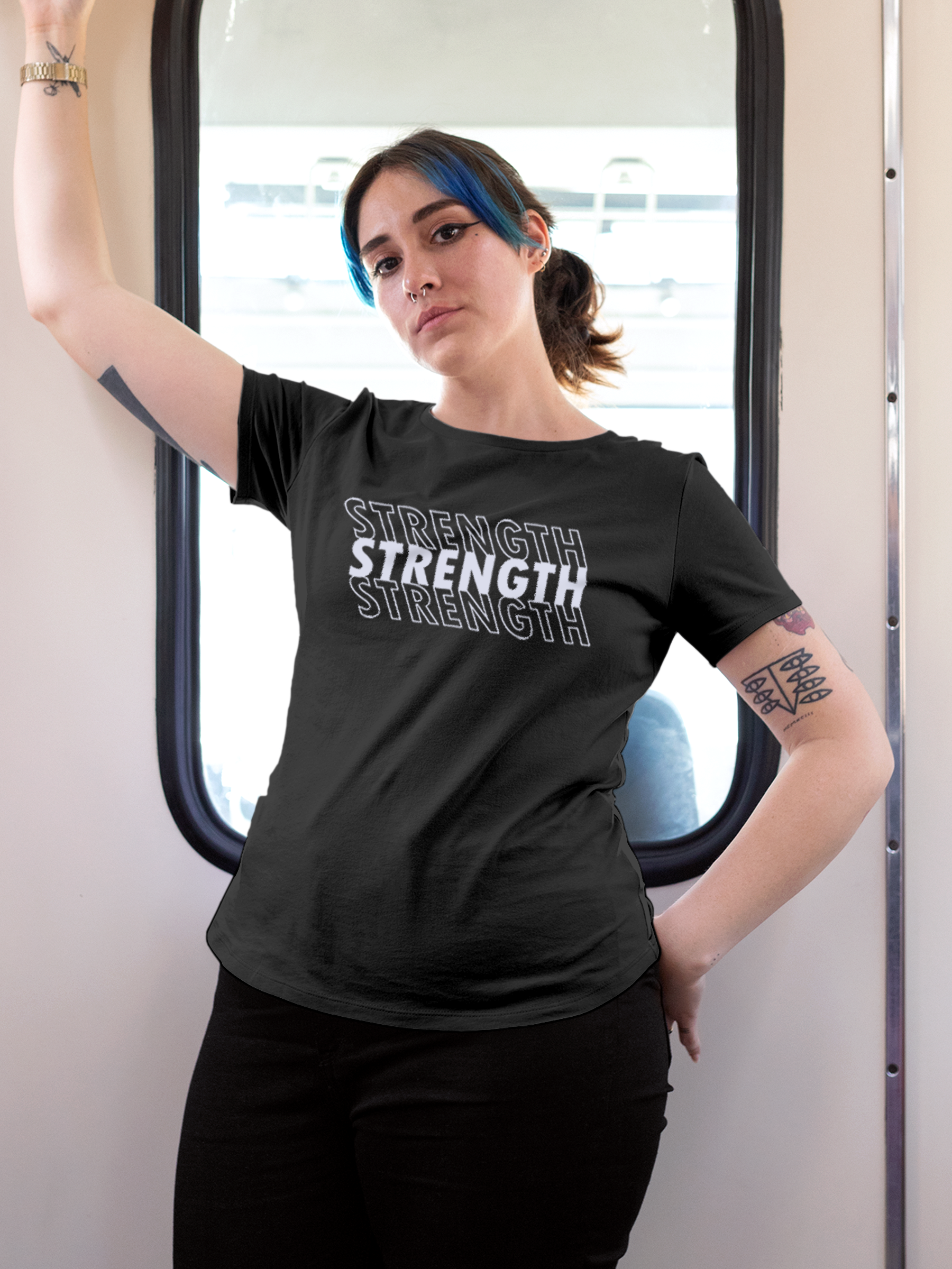 Model wearing Women's Charcoal Grey Round Neck T-shirt with 'Strength' design, offering effortless style and premium comfort