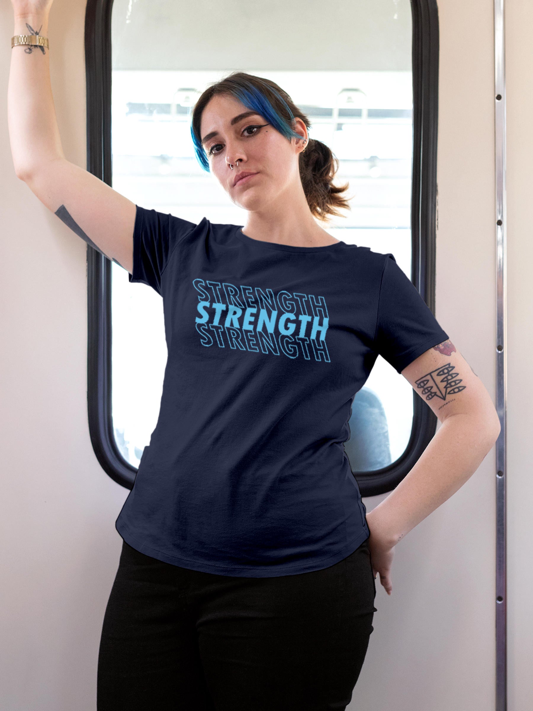 Model wearing Women's Navy Blue Round Neck T-shirt with 'Strength' design, offering effortless style and premium comfort