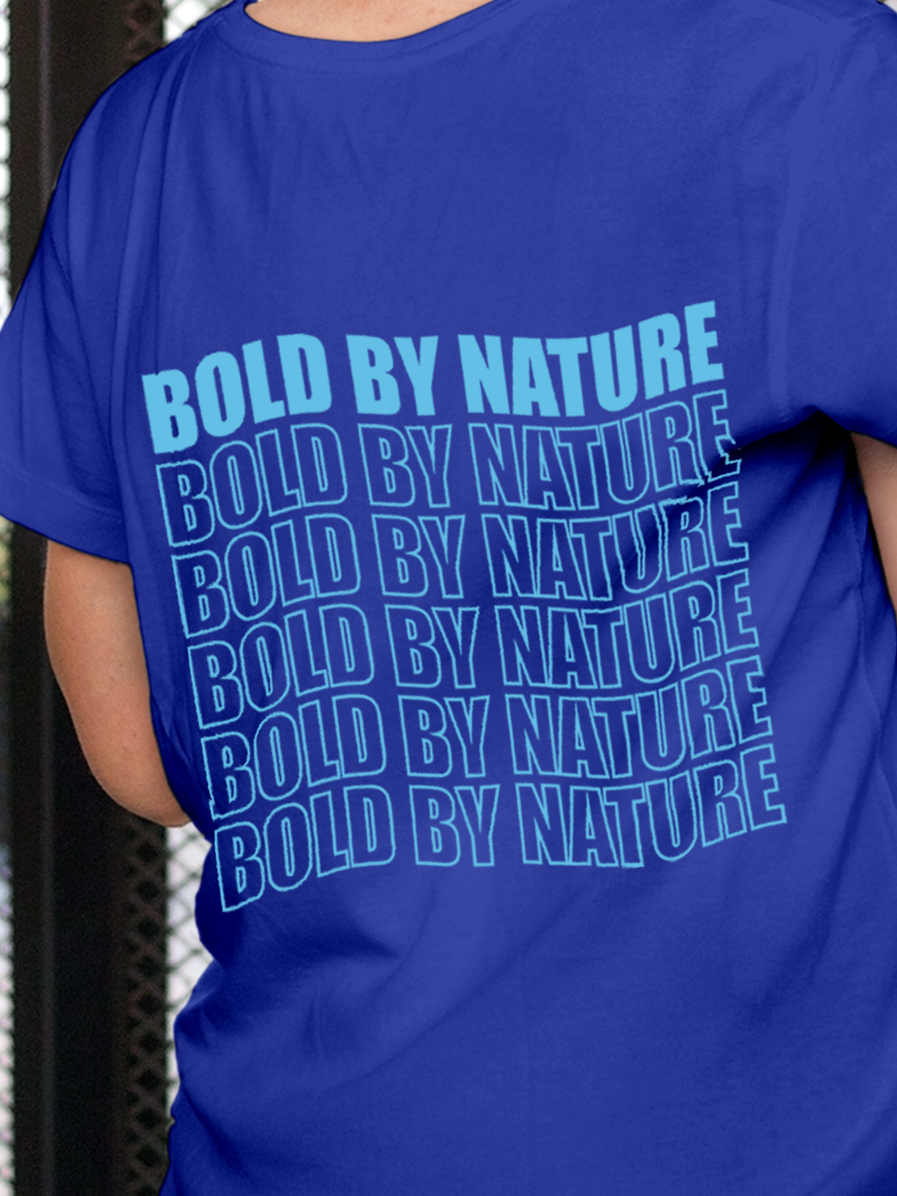 Close up of 'Bold By Nature' design on Women's Blue Round Neck T-shirt, highlighting intricate details and vibrant print.