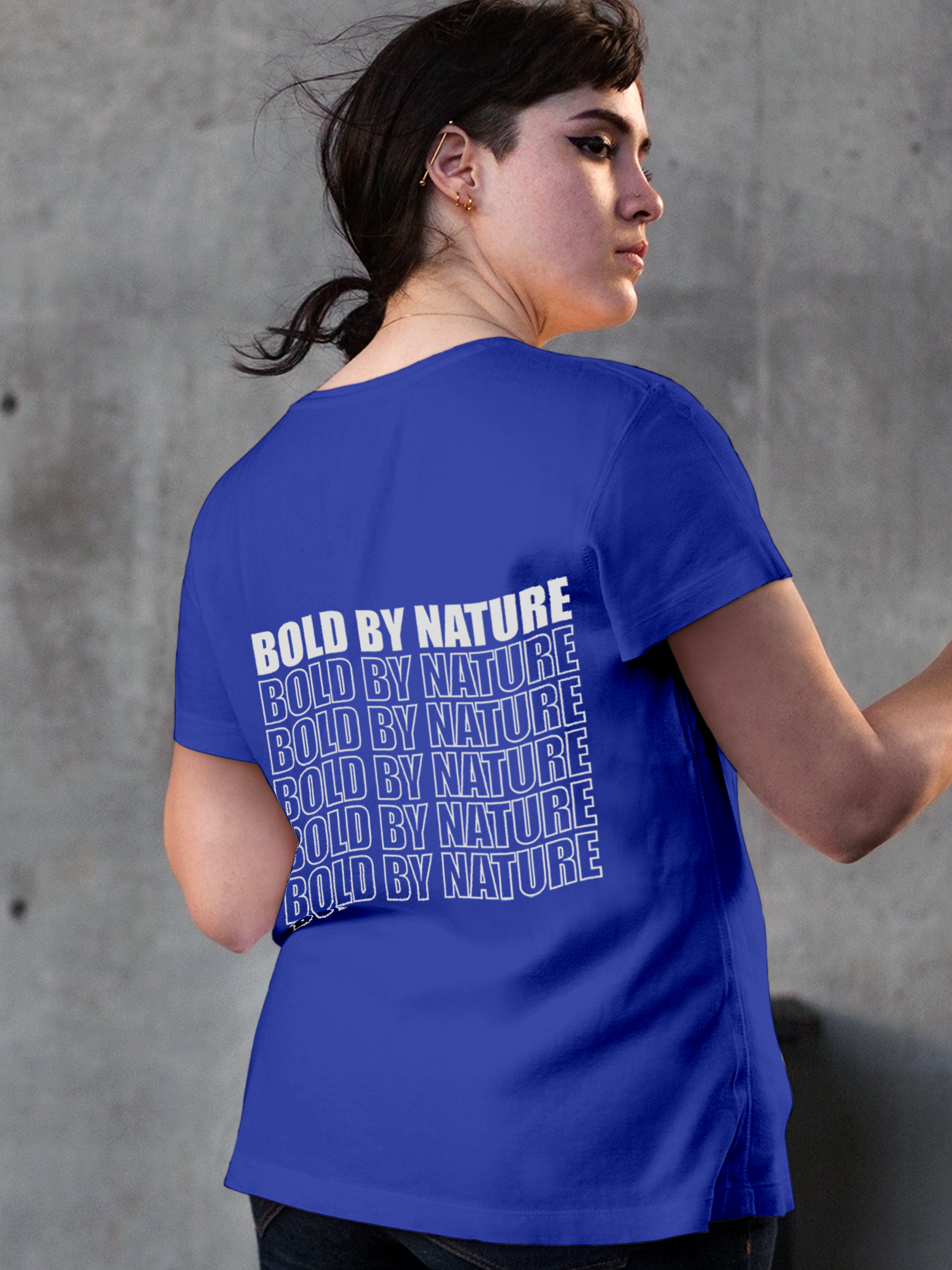Model wearing Women's Blue Round Neck T-shirt with 'Bold By Nature' design, offering effortless style and premium comfort