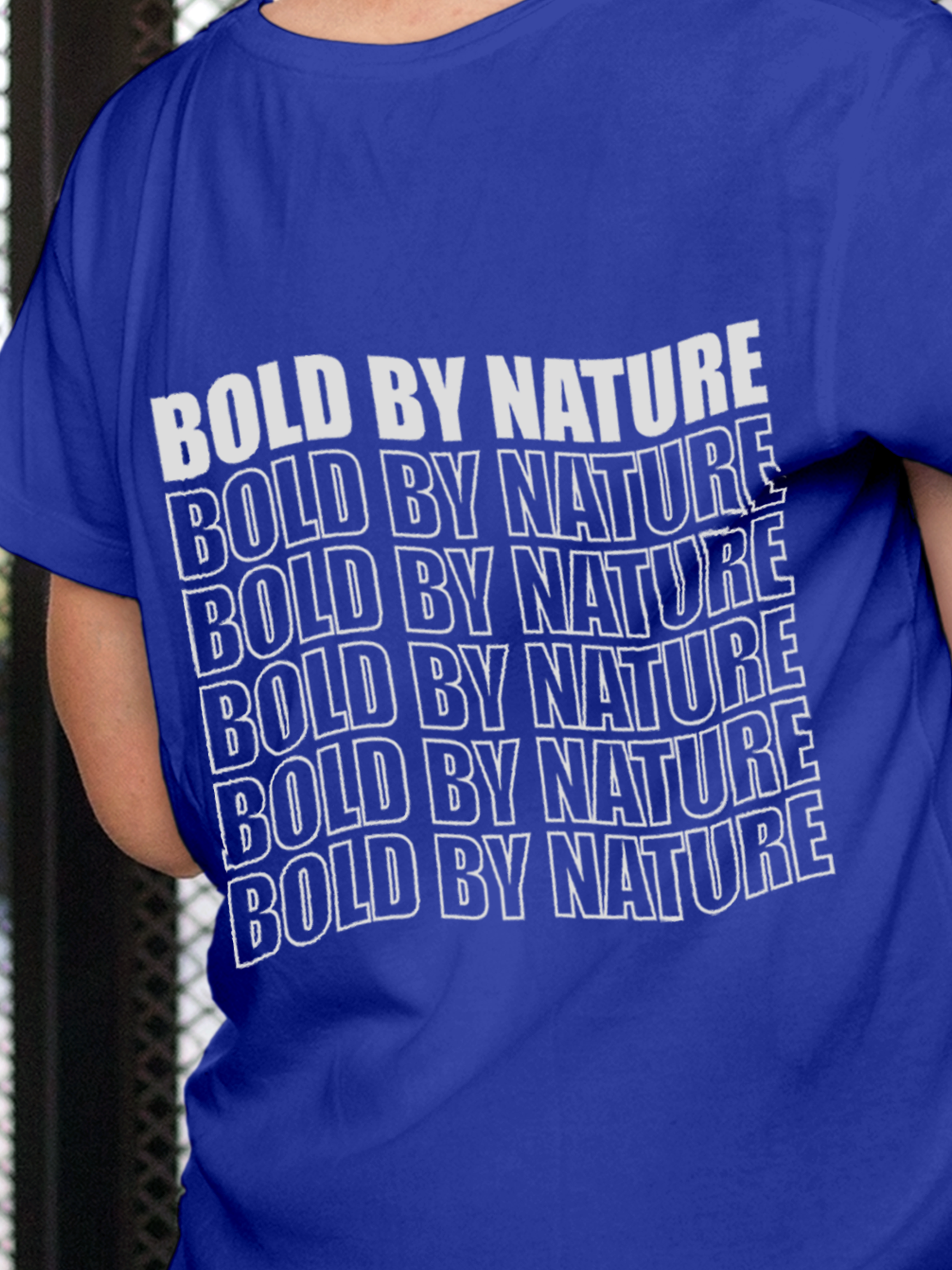 Close up of 'Bold By Nature' design on Women's Blue Round Neck T-shirt, highlighting intricate details and vibrant print.