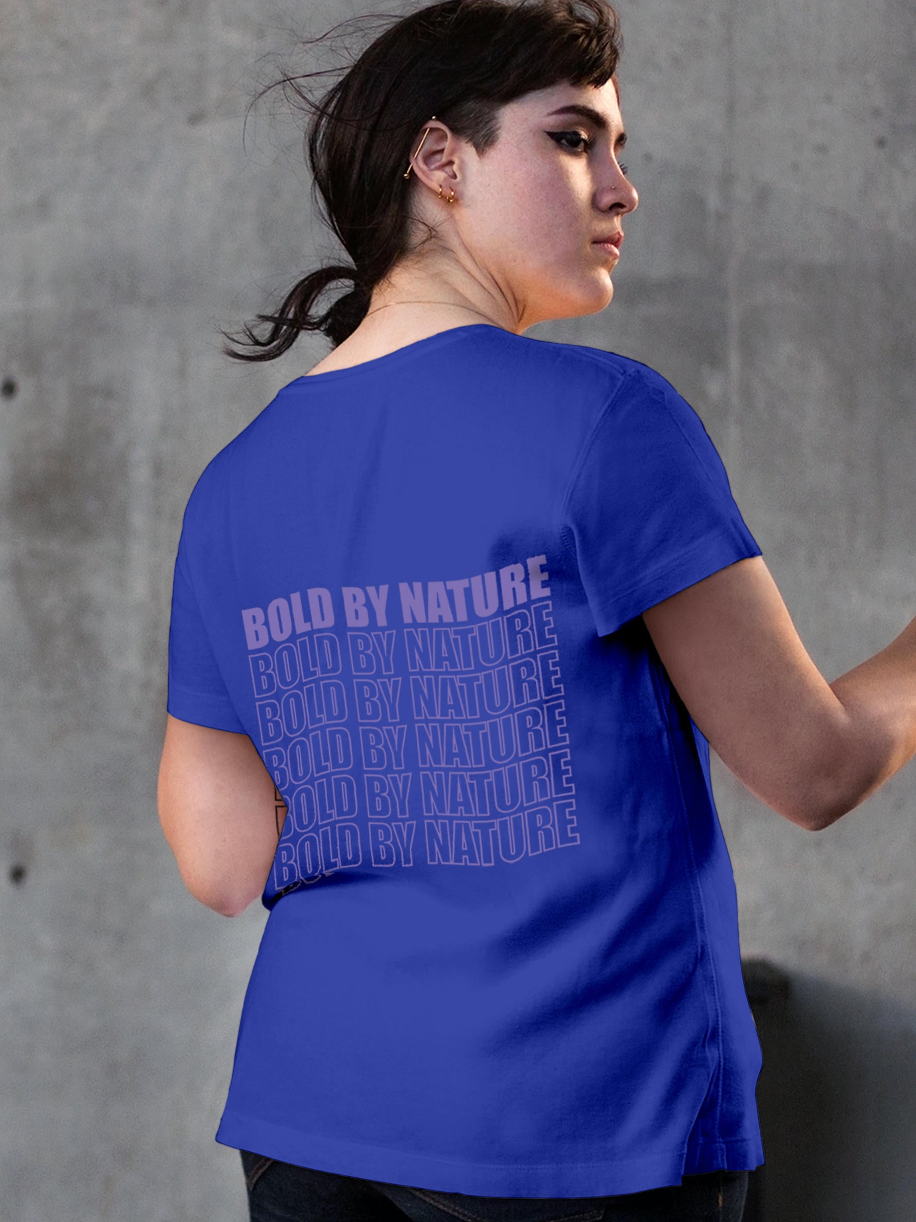 Model wearing Women's Blue Round Neck T-shirt with 'Bold By Nature' design, offering effortless style and premium comfort