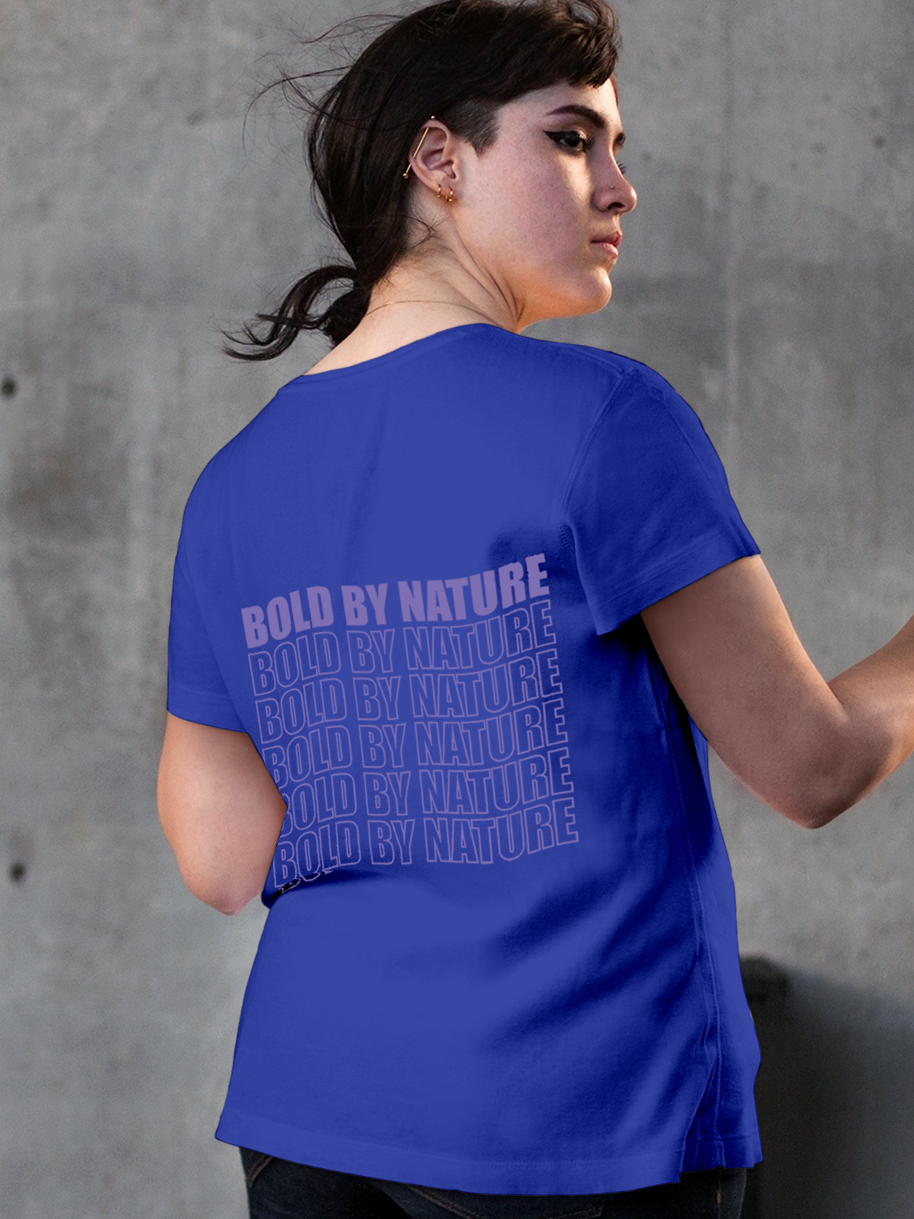 Model wearing Women's Blue Round Neck T-shirt with 'Bold By Nature' design, offering effortless style and premium comfort