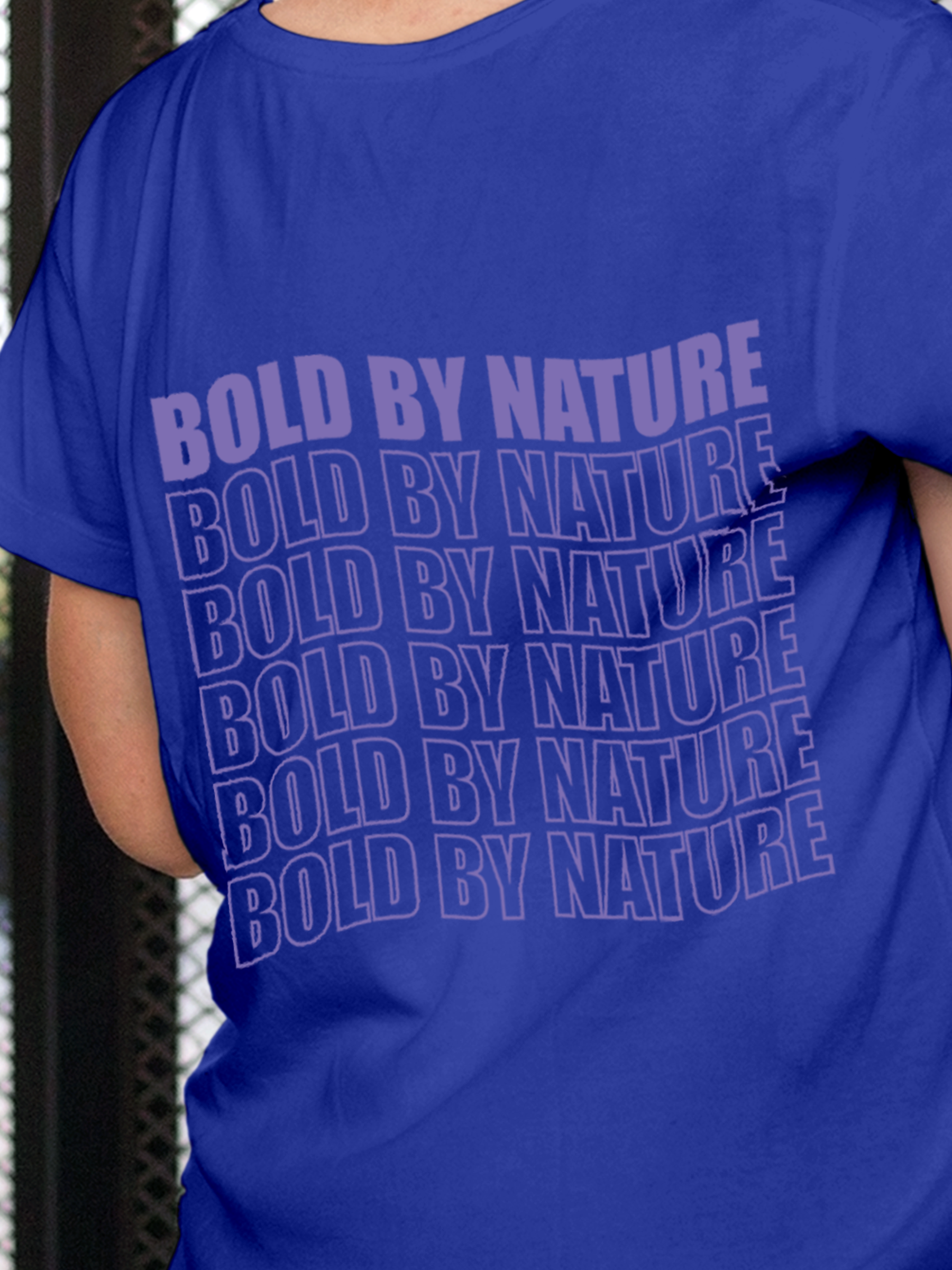 Close up of 'Bold By Nature' design on Women's Blue Round Neck T-shirt, highlighting intricate details and vibrant print.