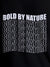 Close up of 'Bold By Nature' design on Men's Black Round Neck T-shirt, highlighting intricate details and vibrant print.