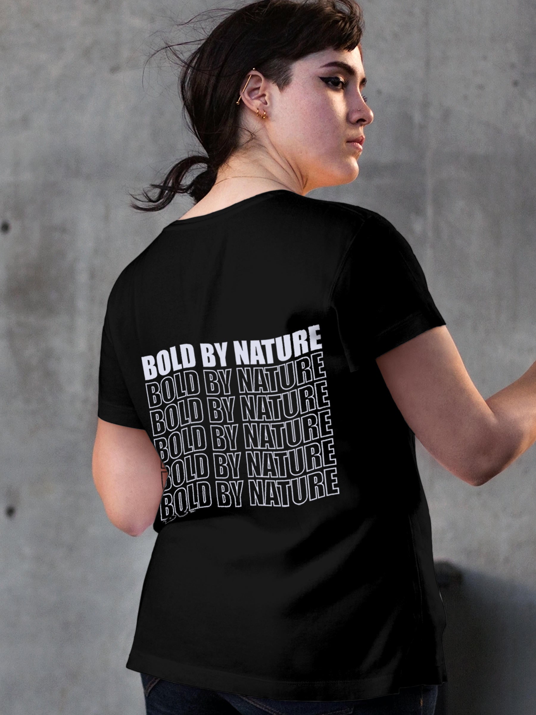 Model wearing Women's Black Round Neck T-shirt with 'Bold By Nature' design, offering effortless style and premium comfort