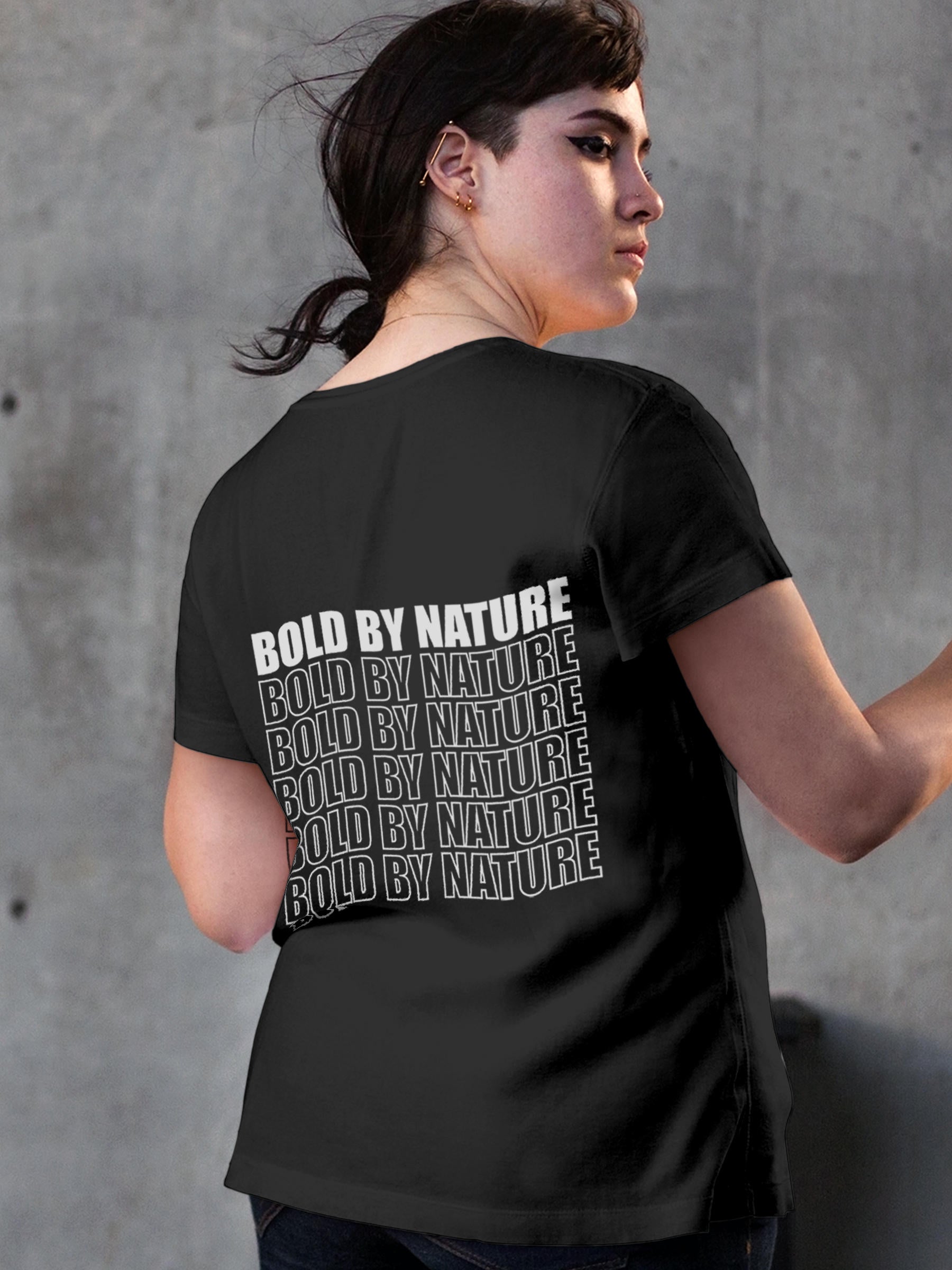 Model wearing Women's Dark Grey Round Neck T-shirt with 'Bold By Nature' design, offering effortless style and premium comfort