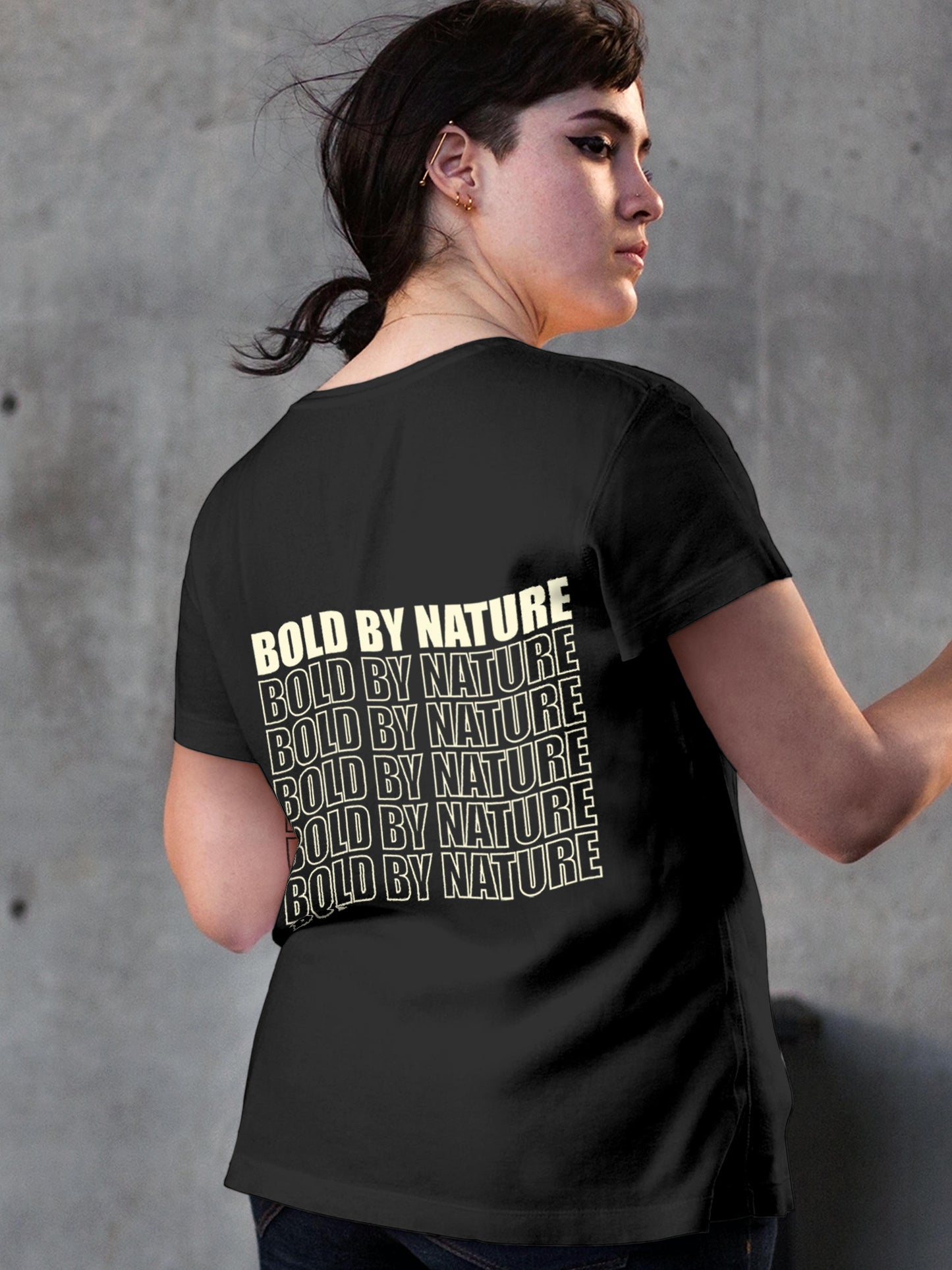 Model wearing Women's Dark Grey Round Neck T-shirt with 'Bold By Nature' design, offering effortless style and premium comfort