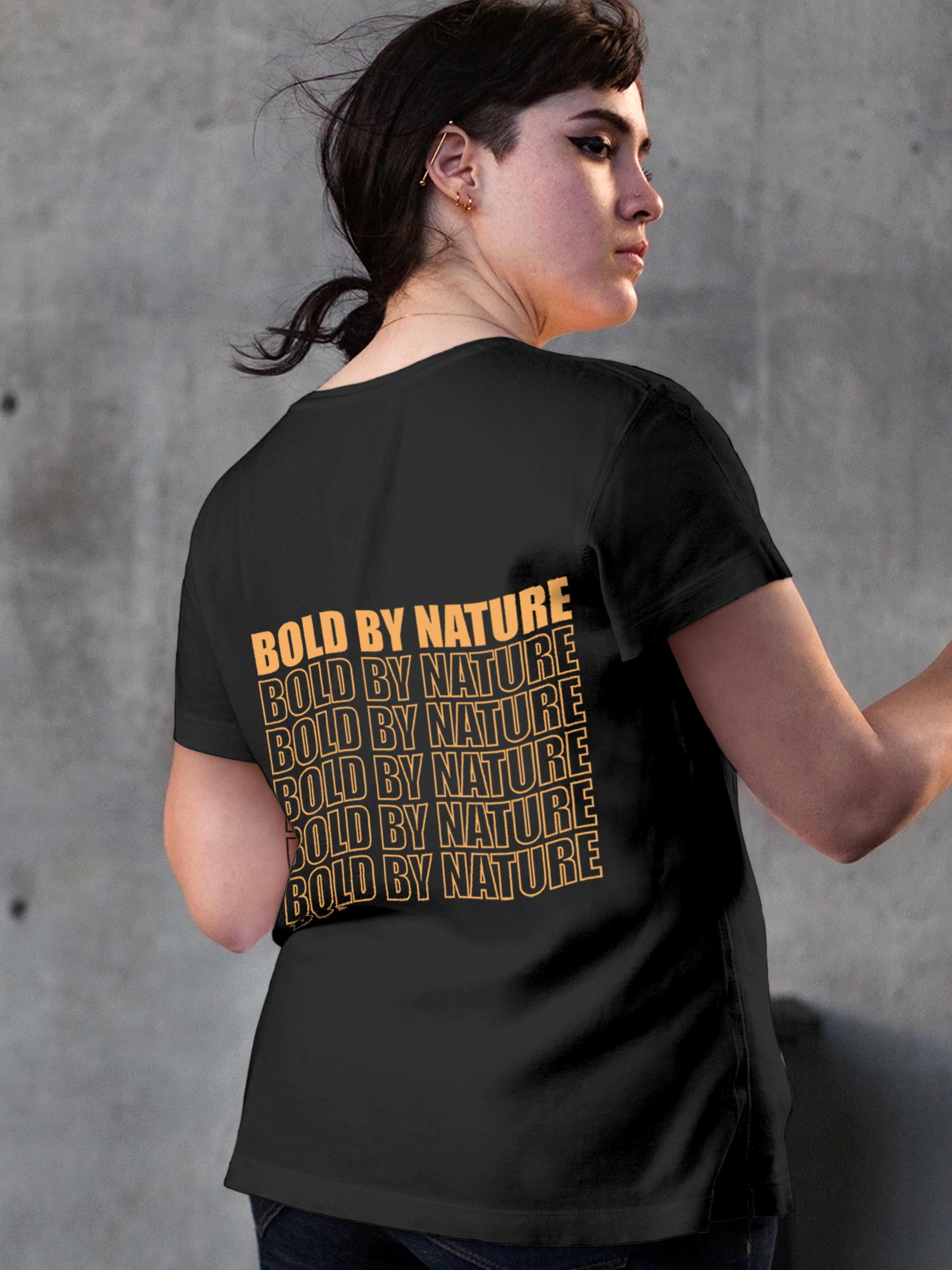 Model wearing Women's Dark Grey Round Neck T-shirt with 'Bold By Nature' design, offering effortless style and premium comfort