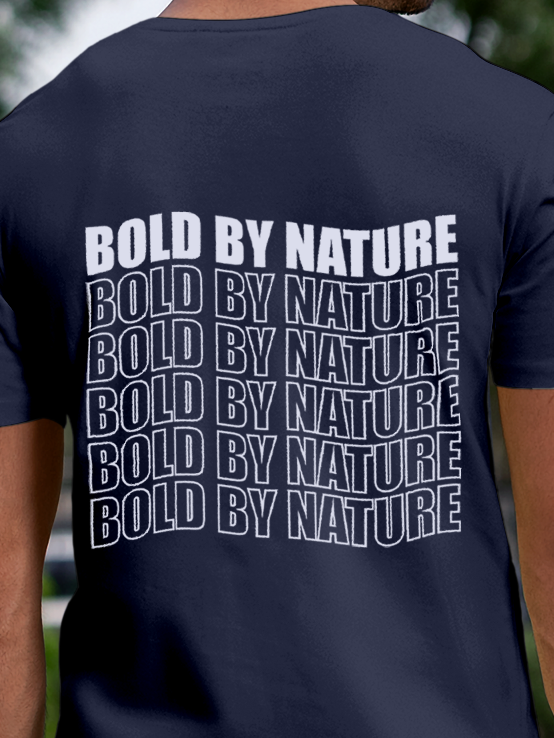 Close up of 'Bold By Nature' design on Men's Navy Blue Round Neck T-shirt, highlighting intricate details and vibrant print.