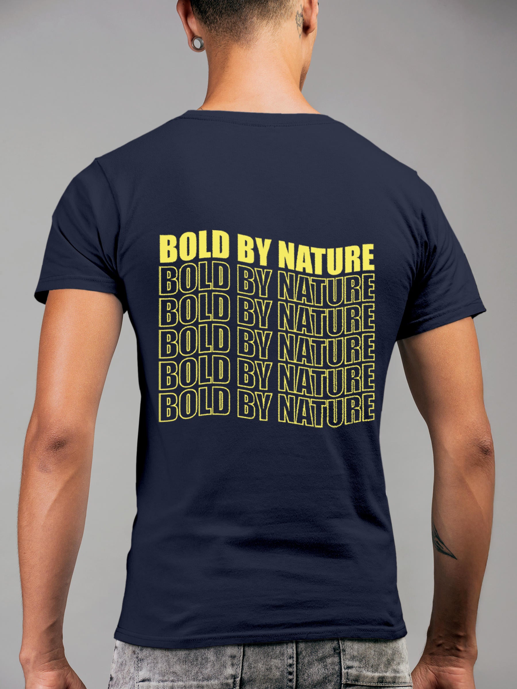 Model wearing Men's Navy Blue Round Neck T-shirt with 'Bold By Nature' design, offering effortless style and premium comfort