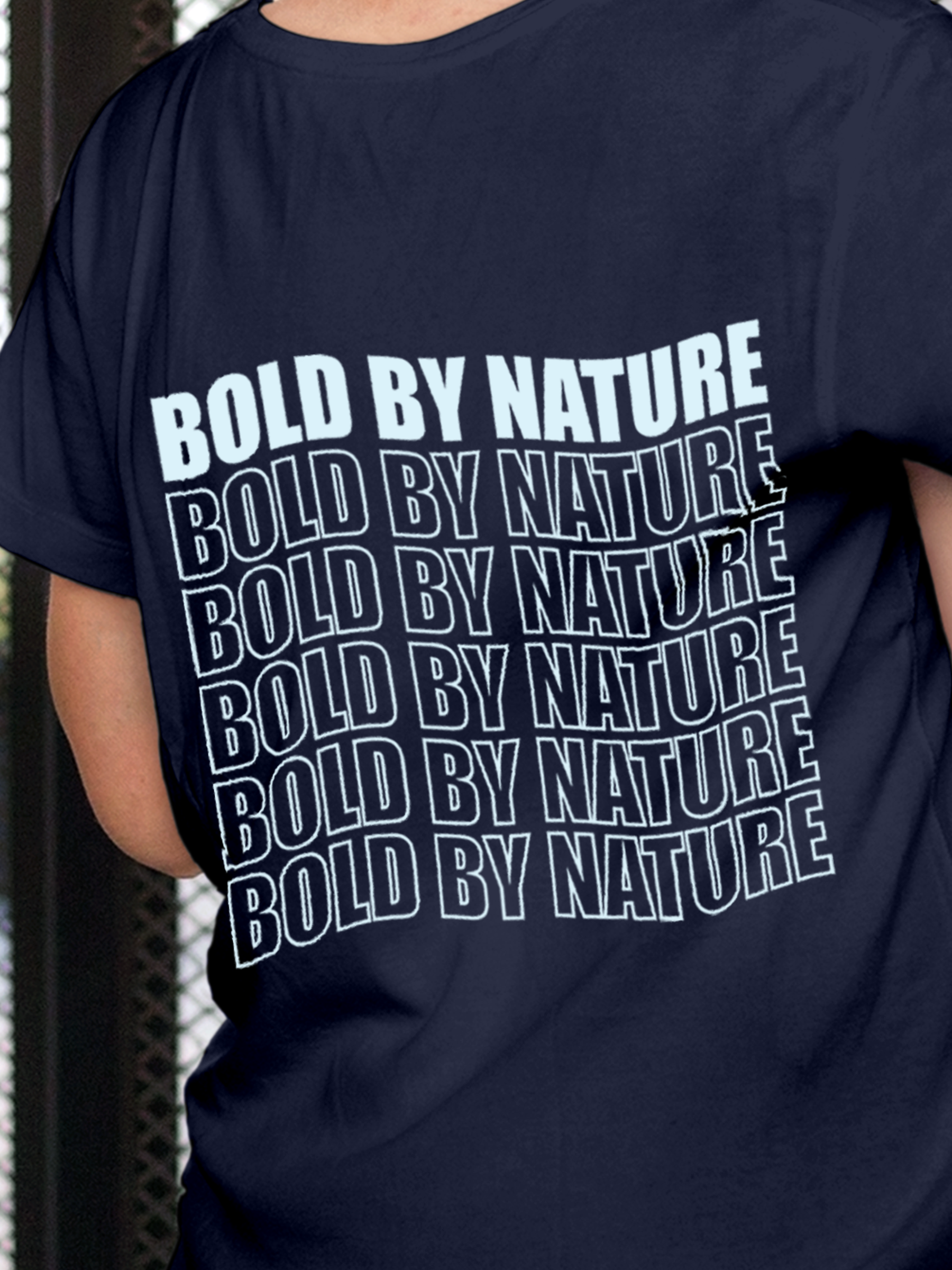 Close up of 'Bold By Nature' design on Women's Navy Blue Round Neck T-shirt, highlighting intricate details and vibrant print.