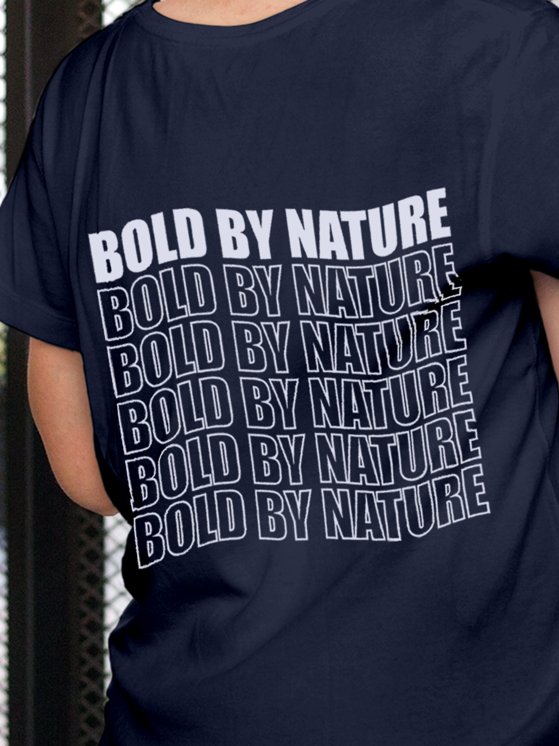 Close up of 'Bold By Nature' design on Women's Navy Blue Round Neck T-shirt, highlighting intricate details and vibrant print.