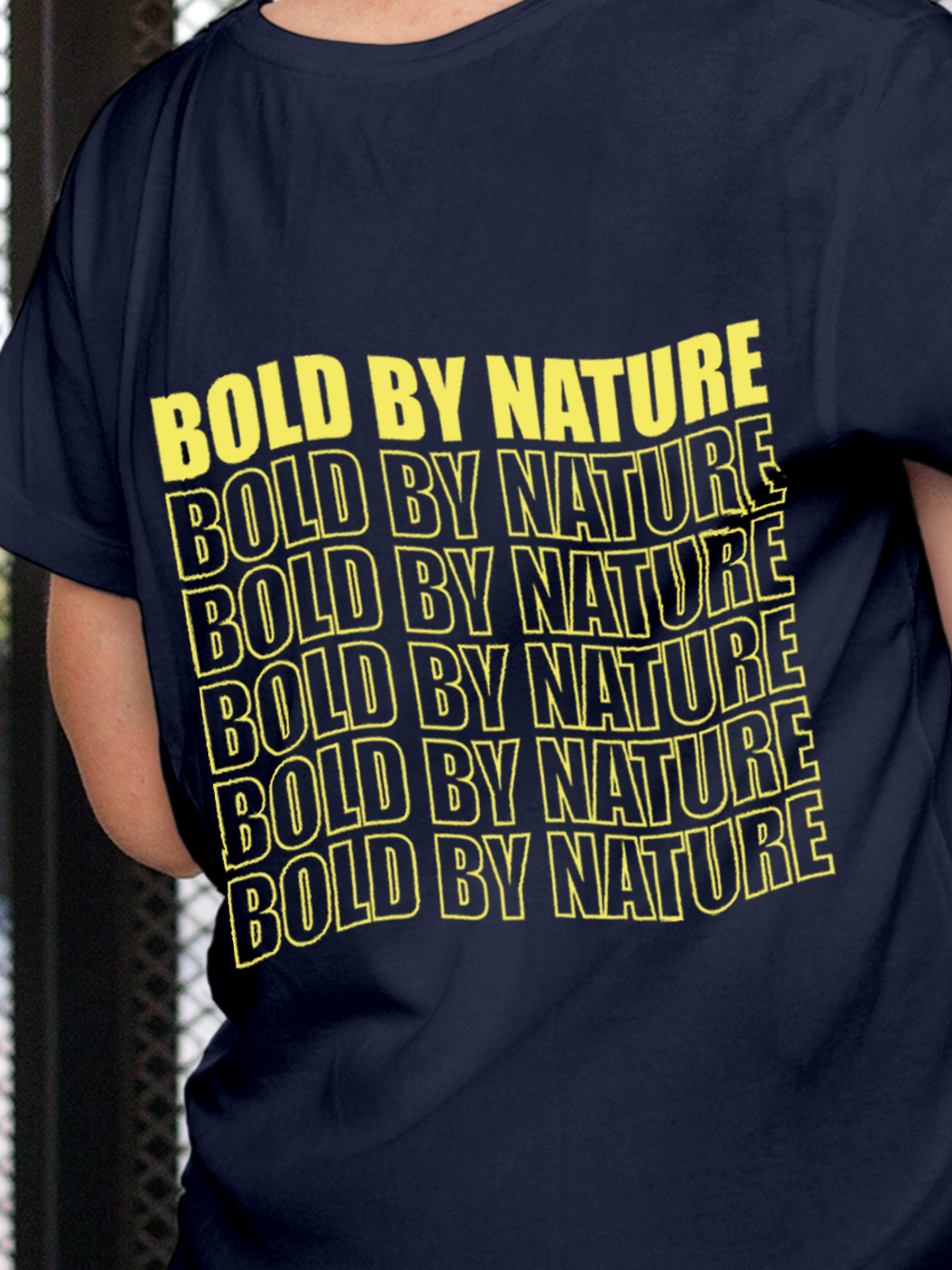Close up of 'Bold By Nature' design on Women's Navy Blue Round Neck T-shirt, highlighting intricate details and vibrant print.