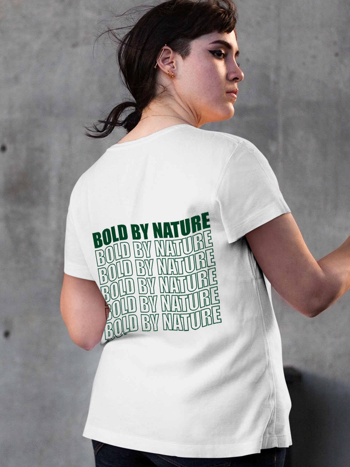 Model wearing Women's White Round Neck T-shirt with 'Bold By Nature' design, offering effortless style and premium comfort