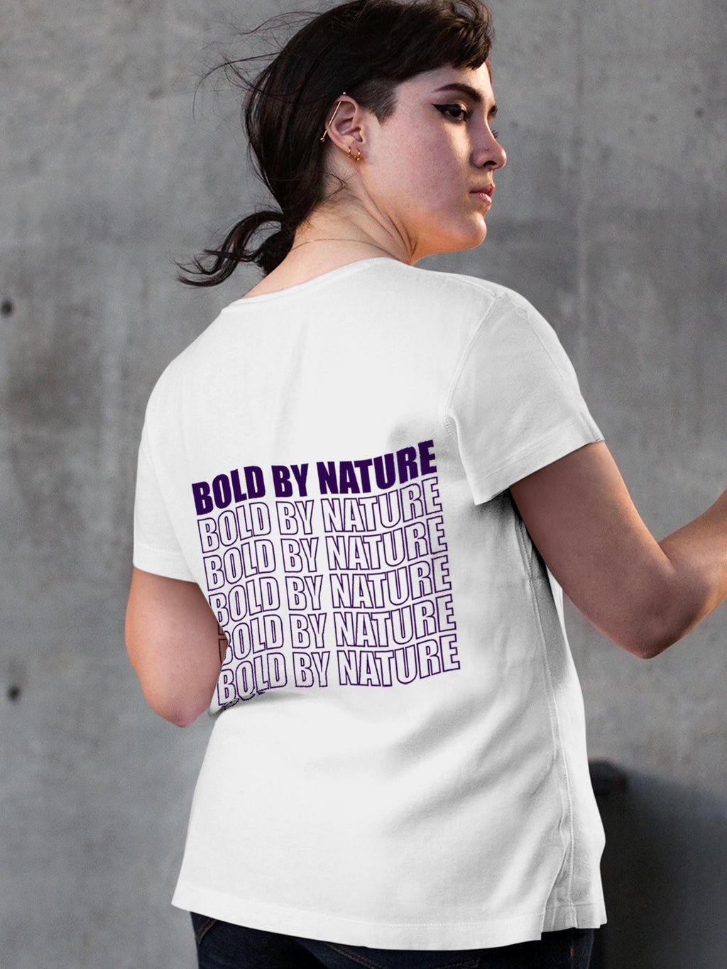 Model wearing Women's White Round Neck T-shirt with 'Bold By Nature' design, offering effortless style and premium comfort