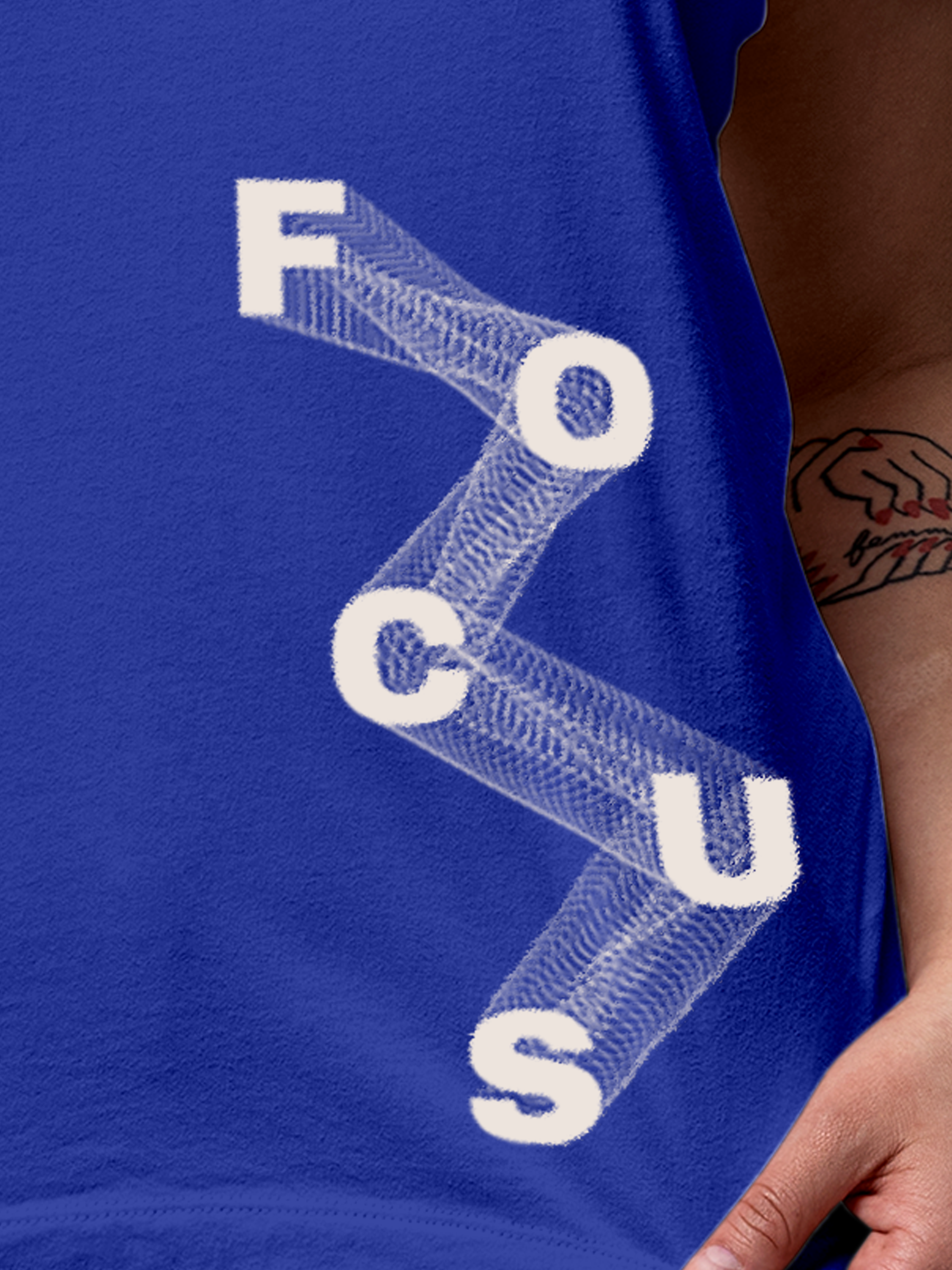 Close up of 'Focus' design on Women's Blue Round Neck T-shirt, highlighting intricate details and vibrant print.