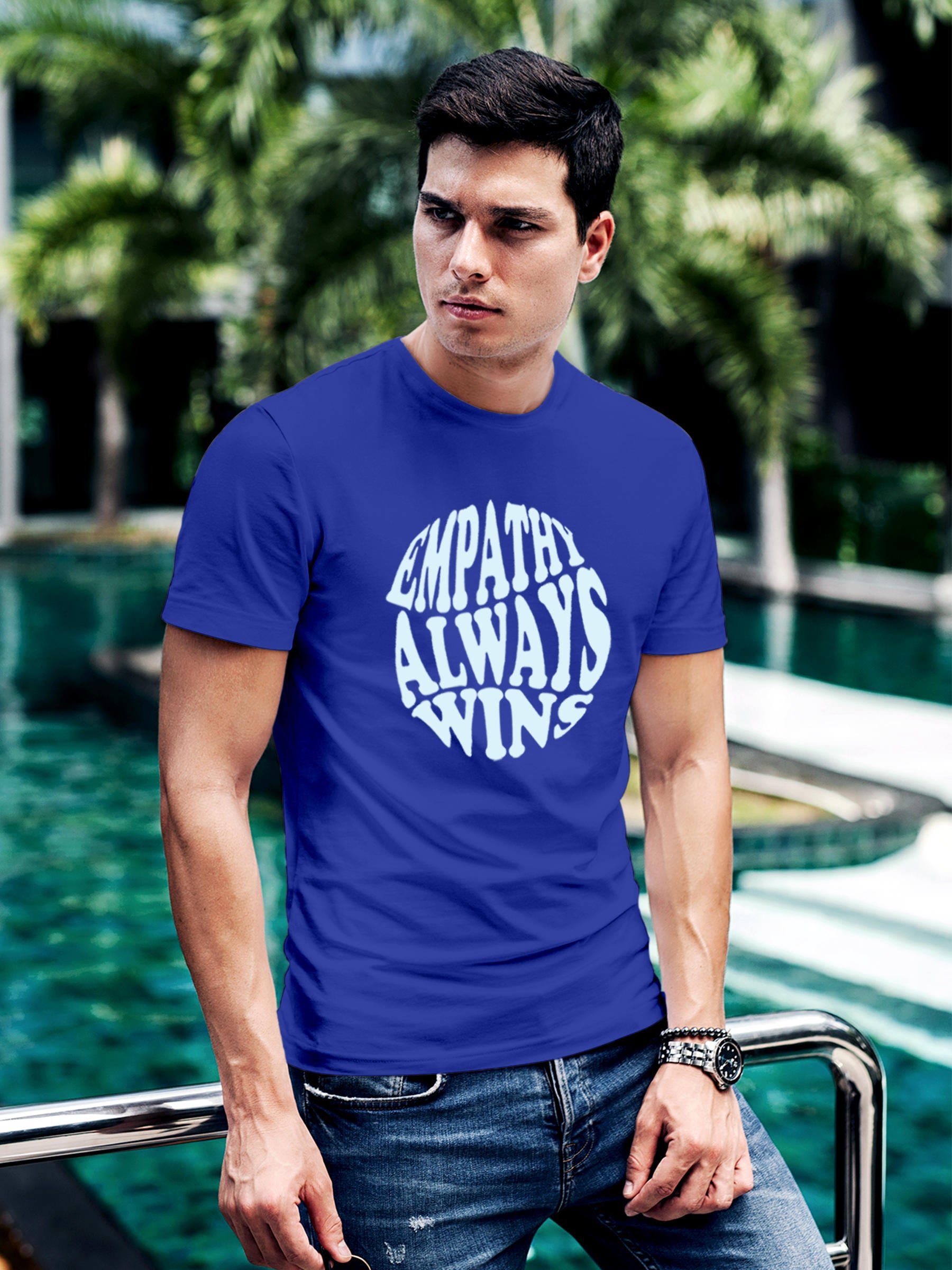 Model wearing Men's Blue Round Neck T-shirt with 'Empathy Always Wins' design, offering effortless style and premium comfort