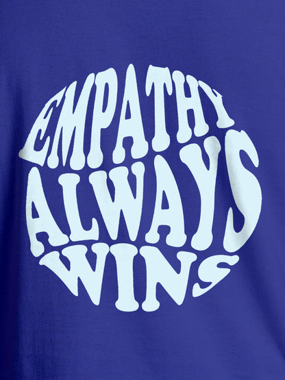 Close up of 'Empathy Always Wins' design on Men's Blue Round Neck T-shirt, highlighting intricate details and vibrant print.